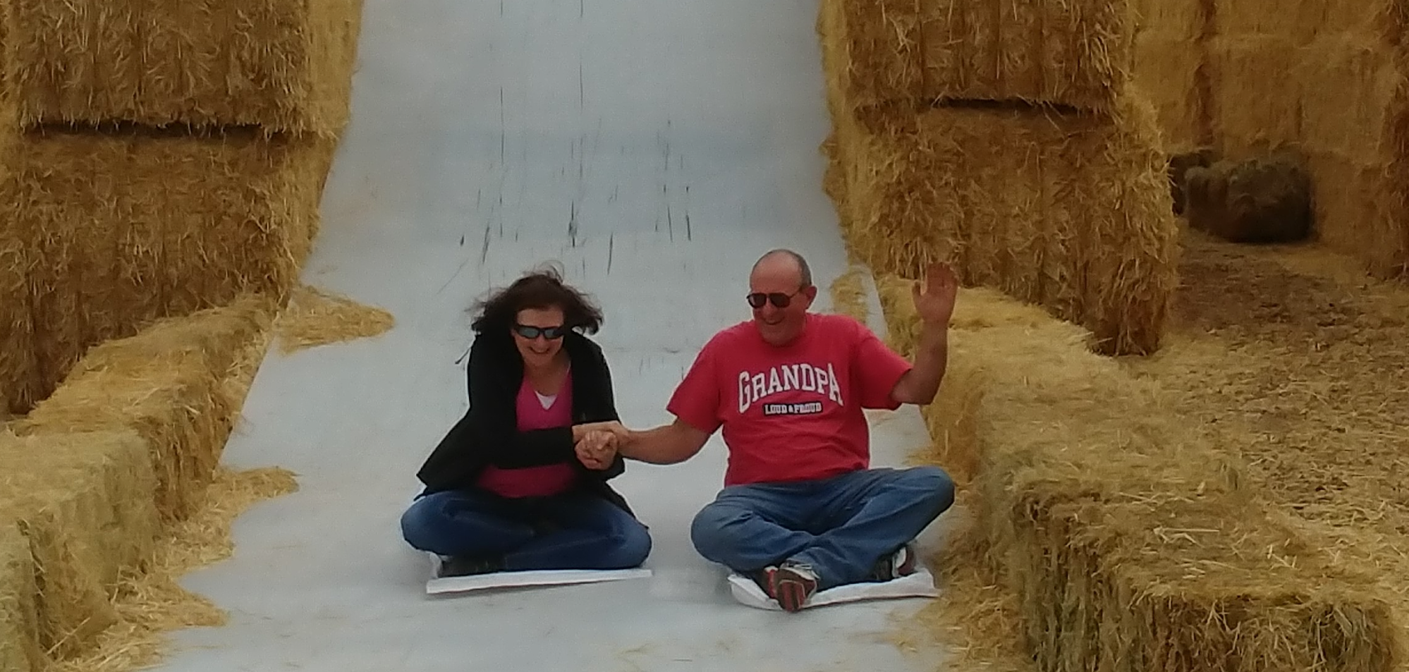 Charming pumpkin patches at Tubbs Berry Farm people going down a slide