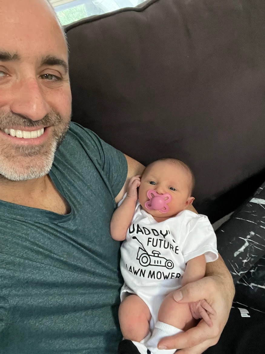 a man holding a baby