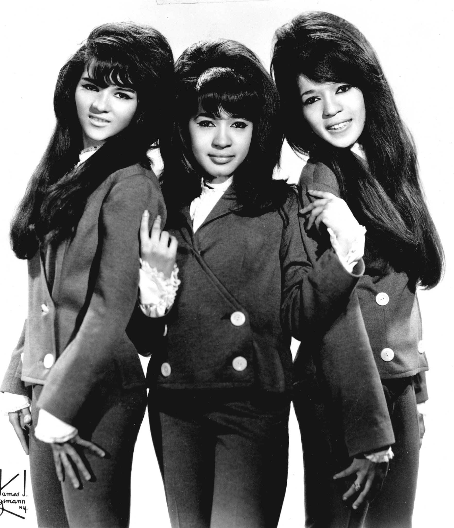 three members of the ronettes standing together in a 1960s publicity photo