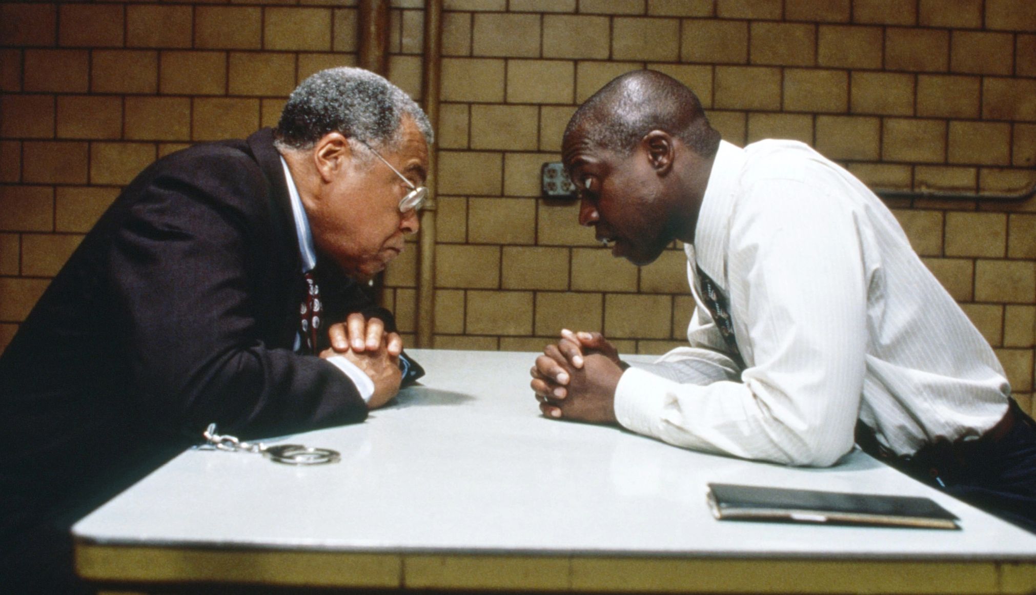 Homicide: Life on the Street James Earl Jones and Andre Braugher staring at each other in an interrogation room in the television series Homicide: Life on the Street