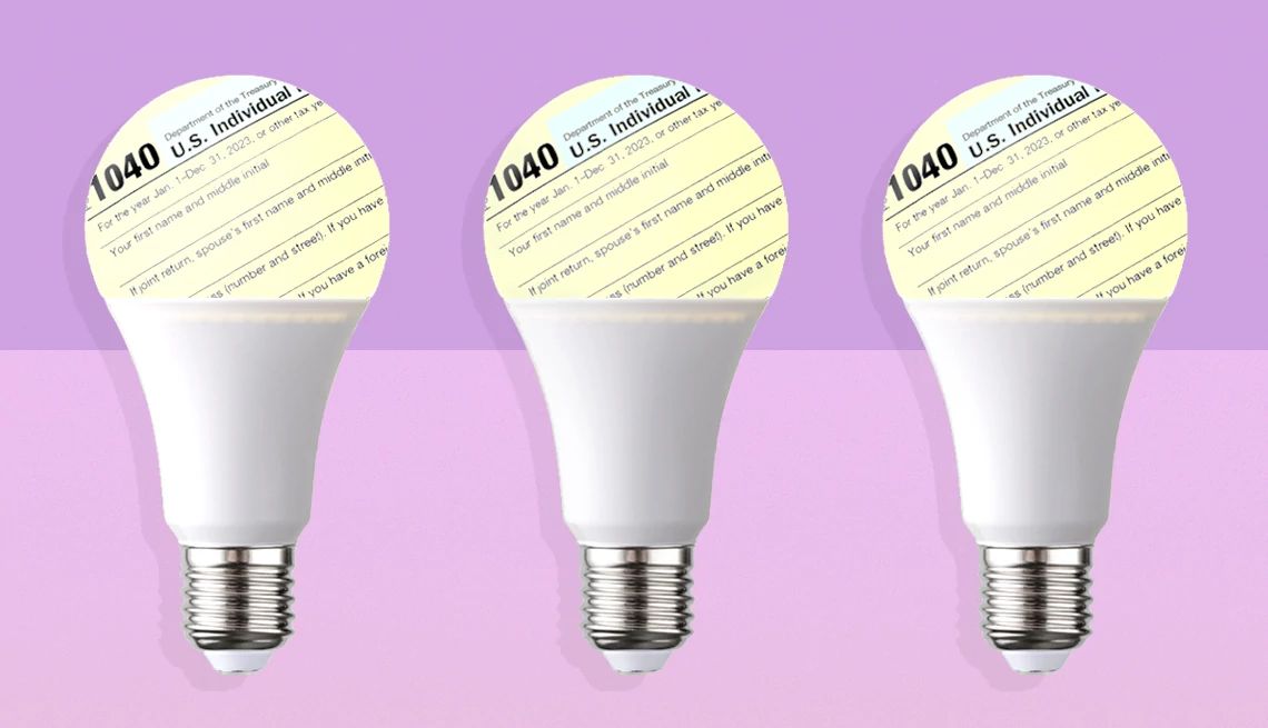 light bulbs with tax forms on a pink field