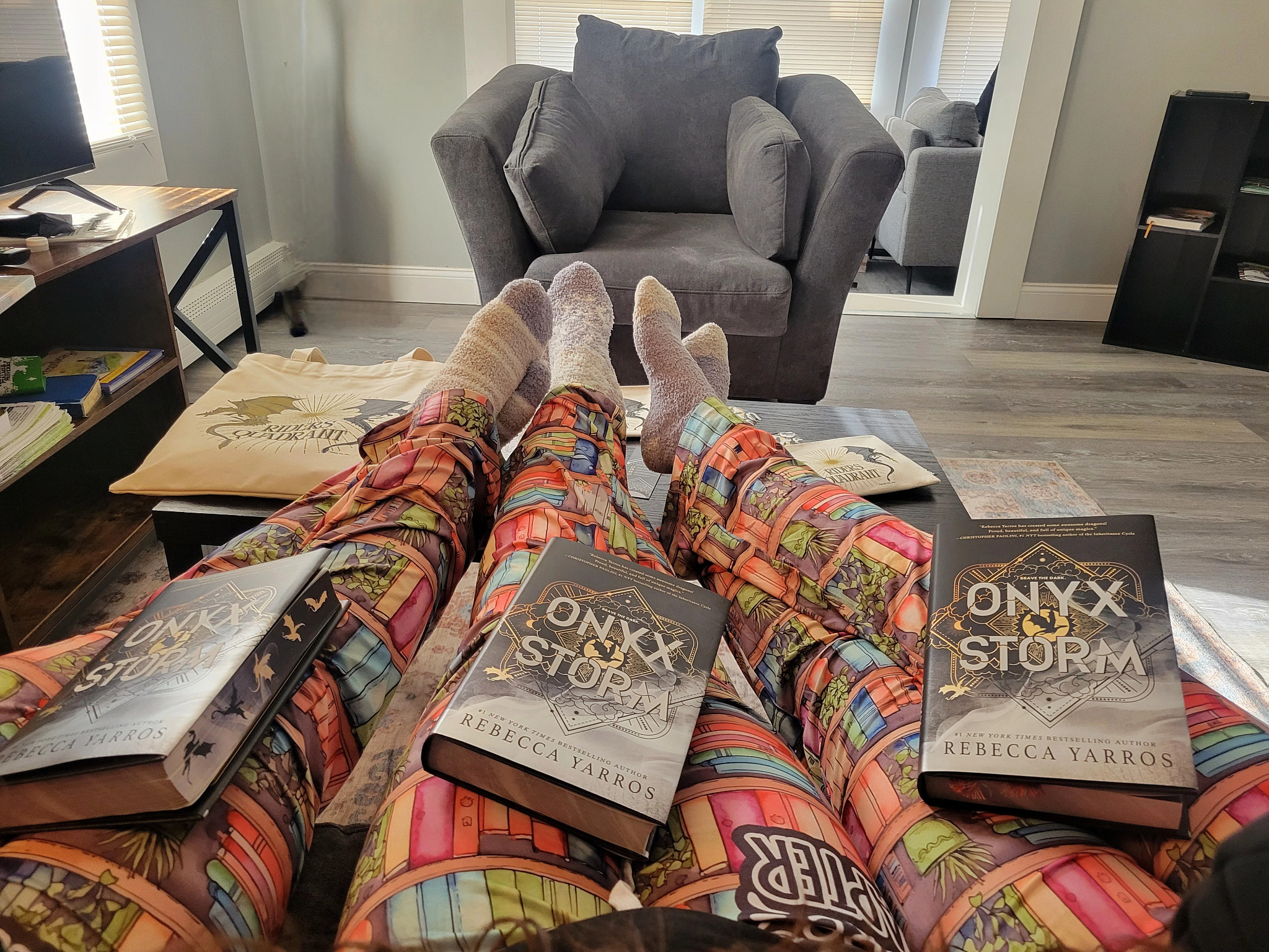 Author and friends pause to show off their merch for a photo.