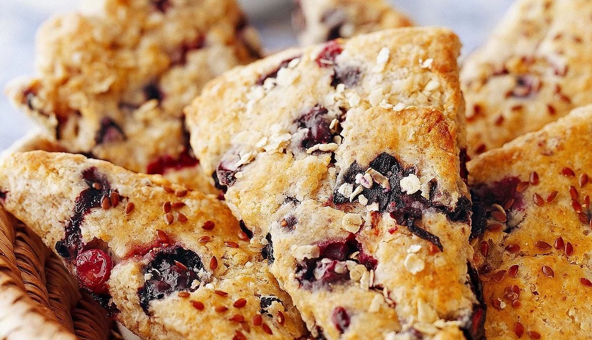 Blueberry-oat scones with flaxseeds A close-up view of blueberry-oat scones with flaxseeds