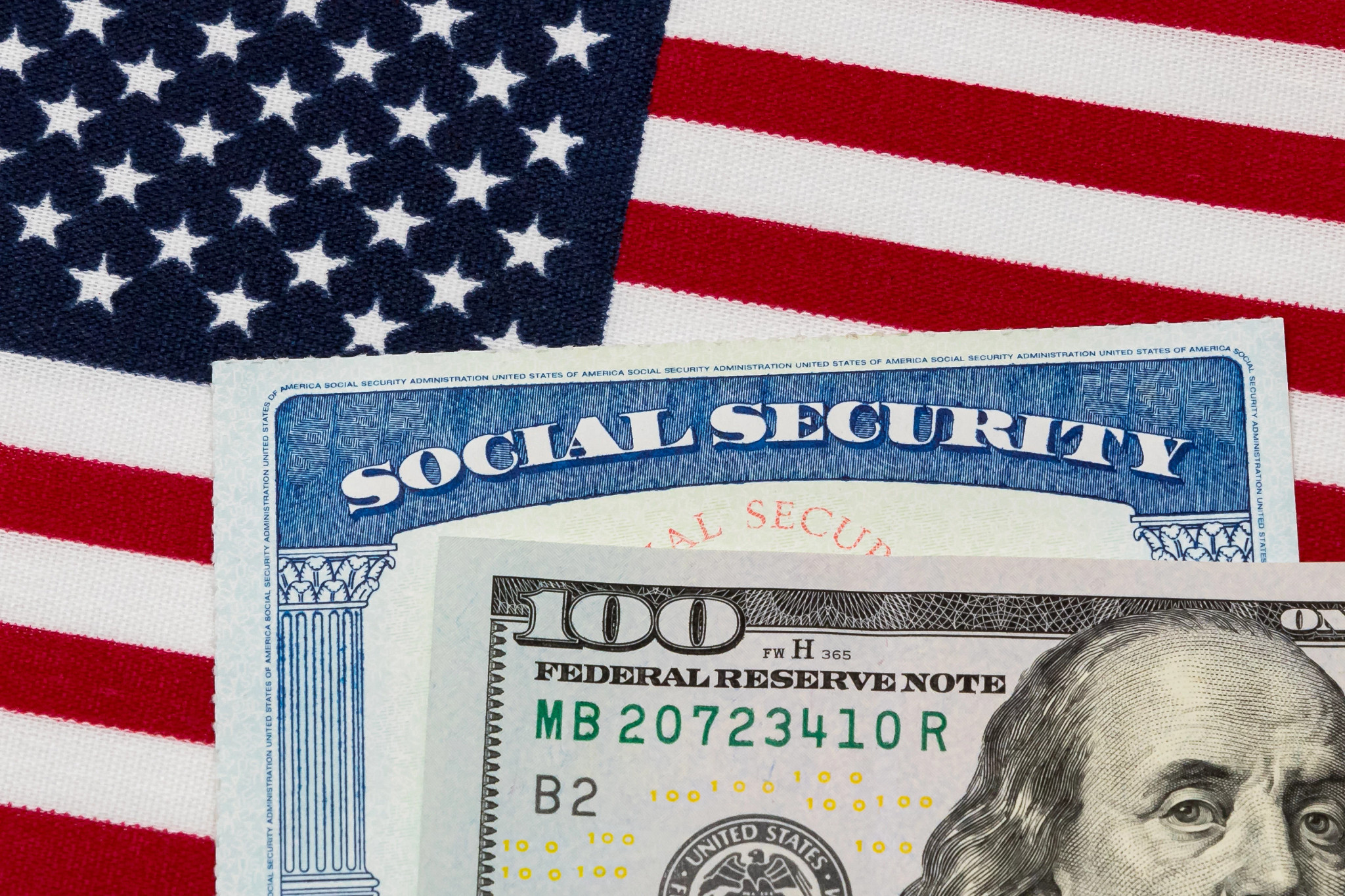 an american flag with money and a social security card