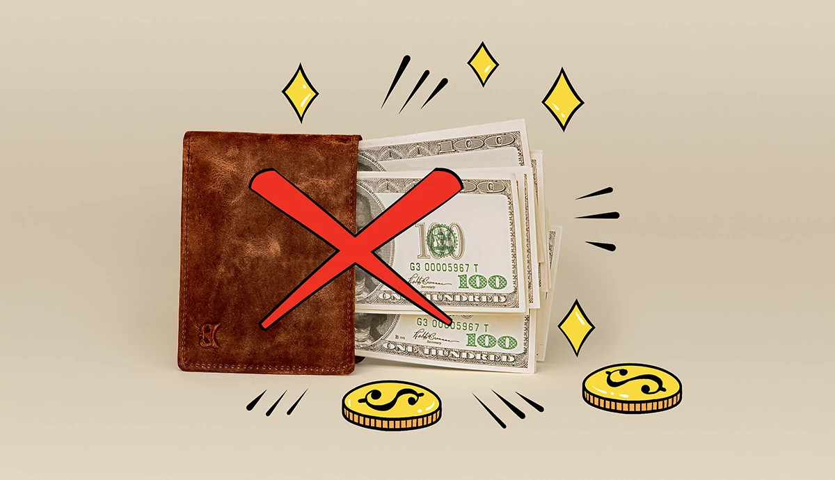 Money and coins fall out of a leather wallet.