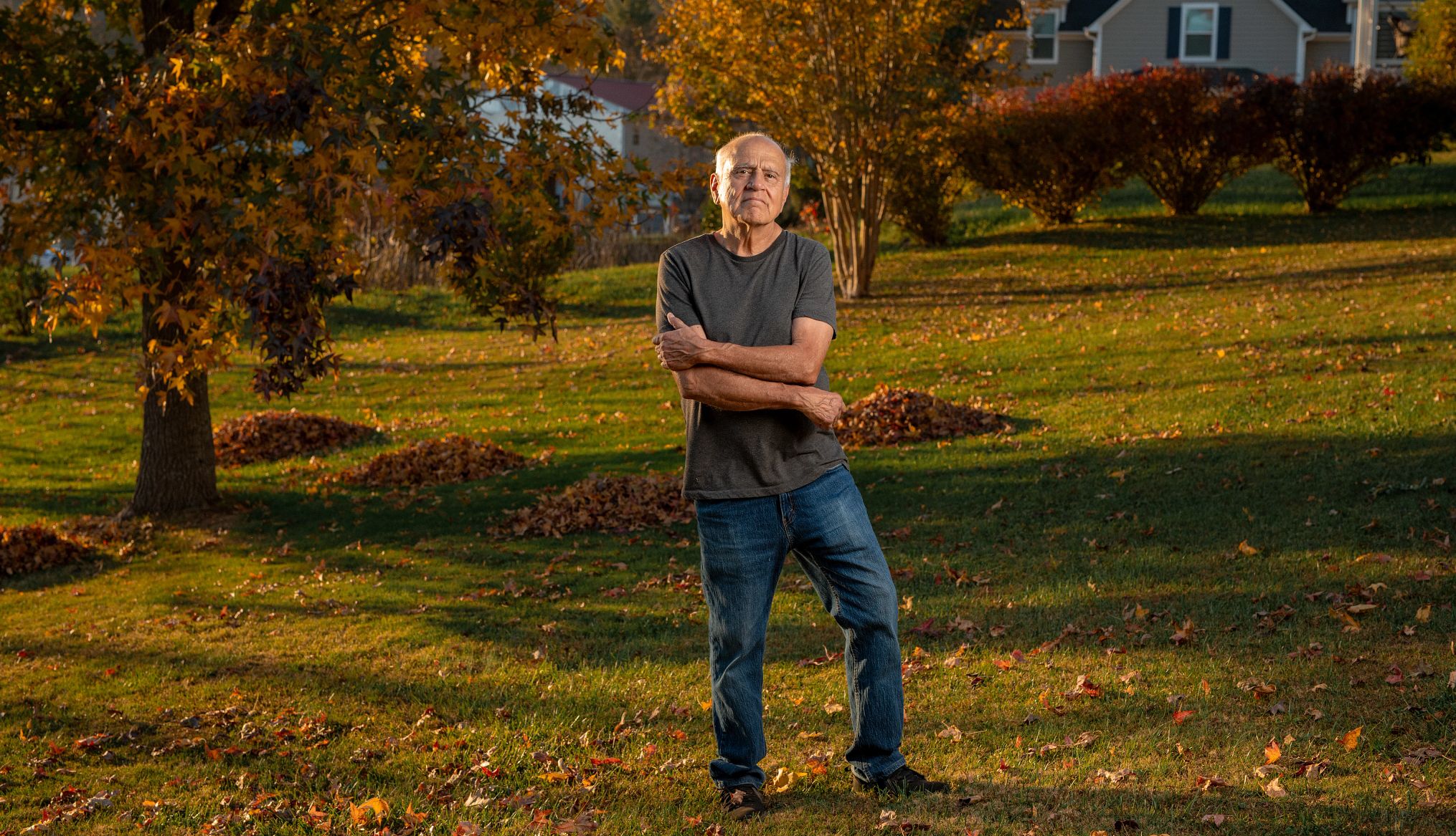 Older voters 2024 ed escalante stands in a leaf covered yard
