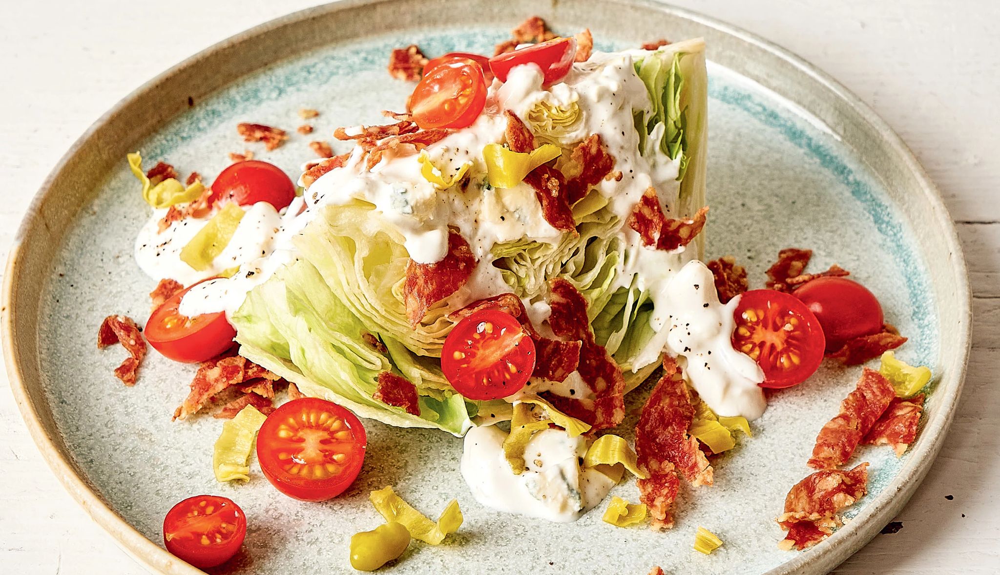 Antipasto Wedge Antipasto Wedge with lettuce, cherry tomatoes, salami and white dressing