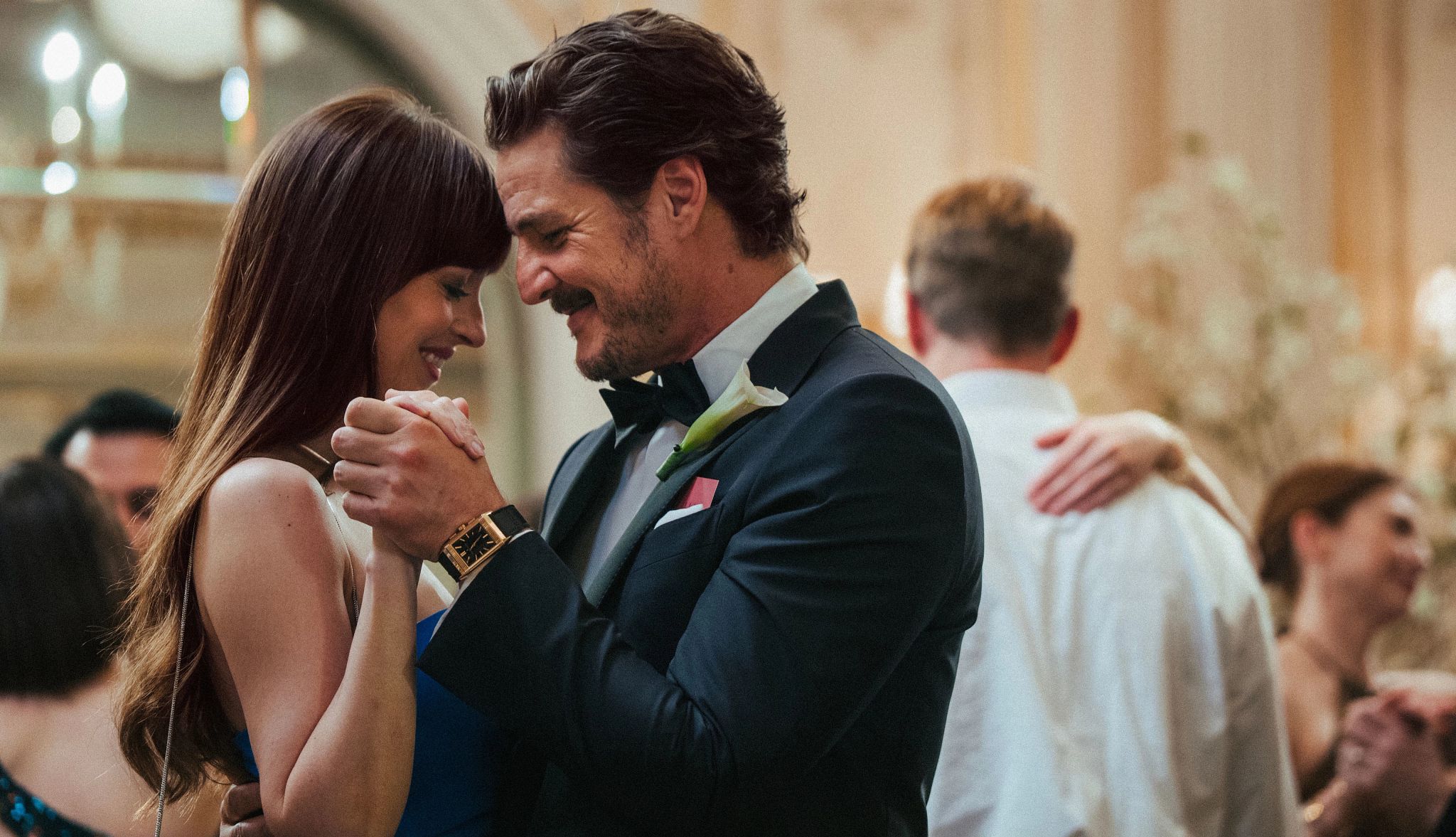 Fun New Rom-Coms to Watch This Summer dakota johnson and pedro pascal sharing an intimate moment while dancing