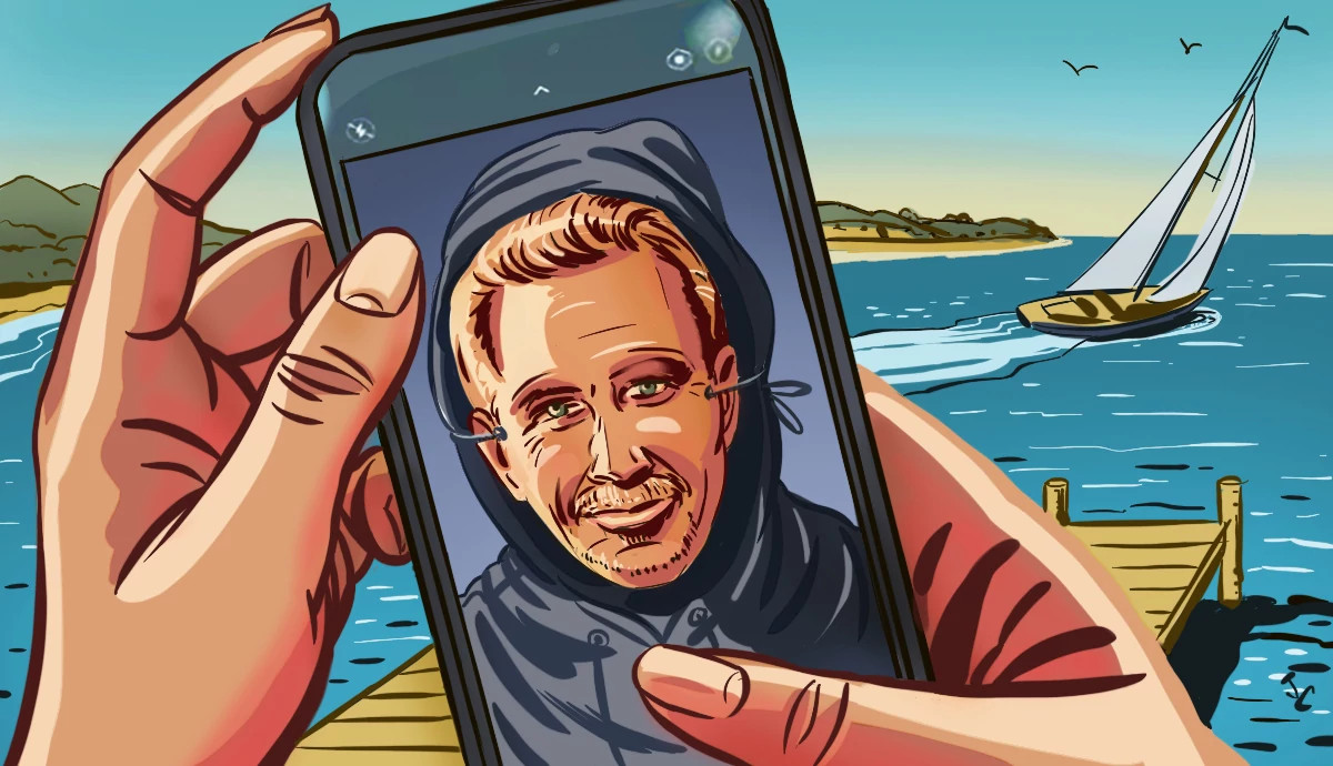 a hand holding a cell phone with a scammer holding up a mask of kevin costner