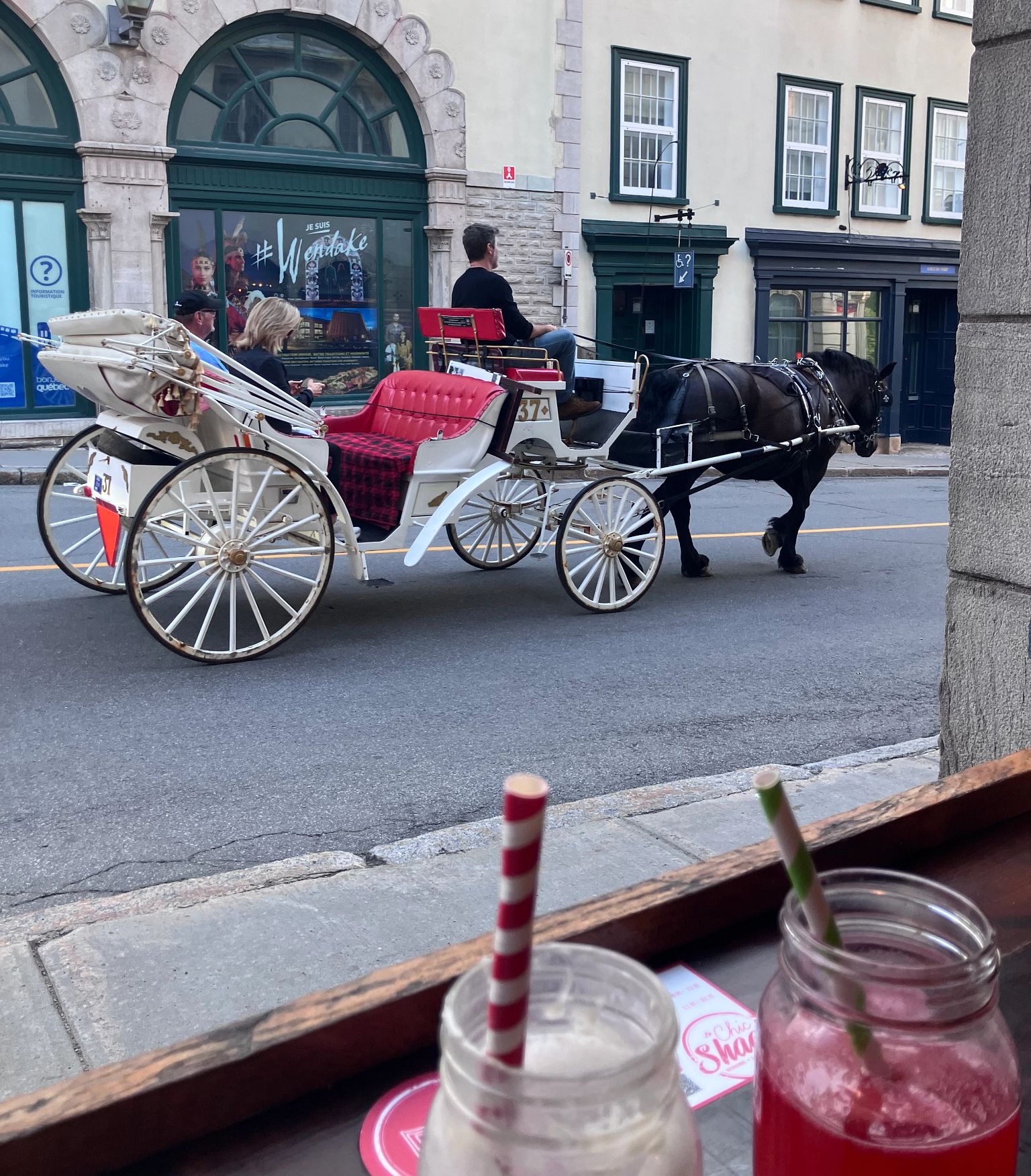 No Cash Overseas Lessons a horse drawn carriage on a street