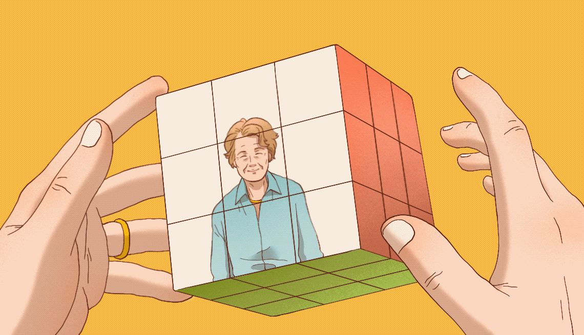 an animated gif shows and older adult woman working a twisty puzzle. The tiles on the puzzle show a photo of her and her grandsons