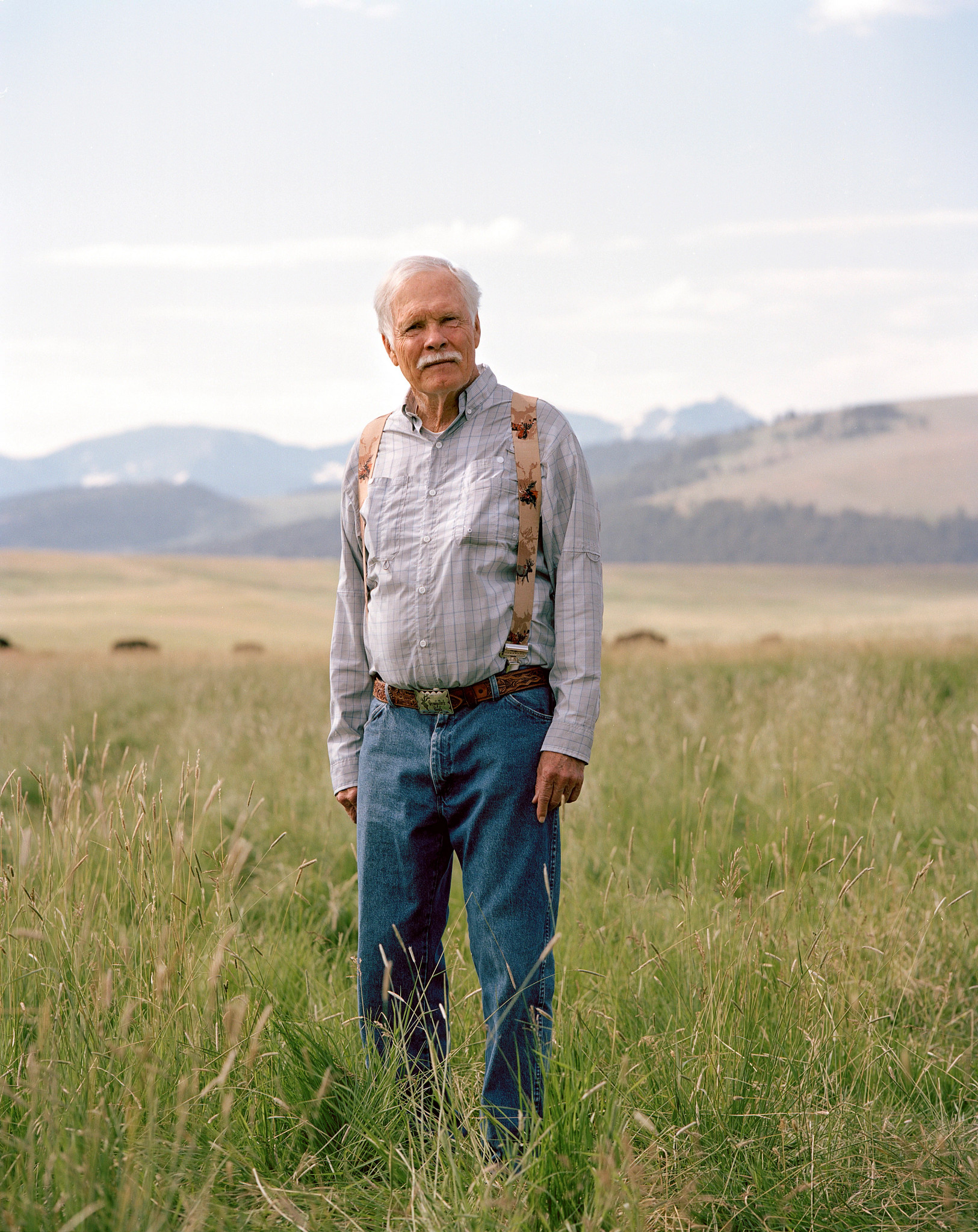 ted turner in farm clothes outdoors in montana