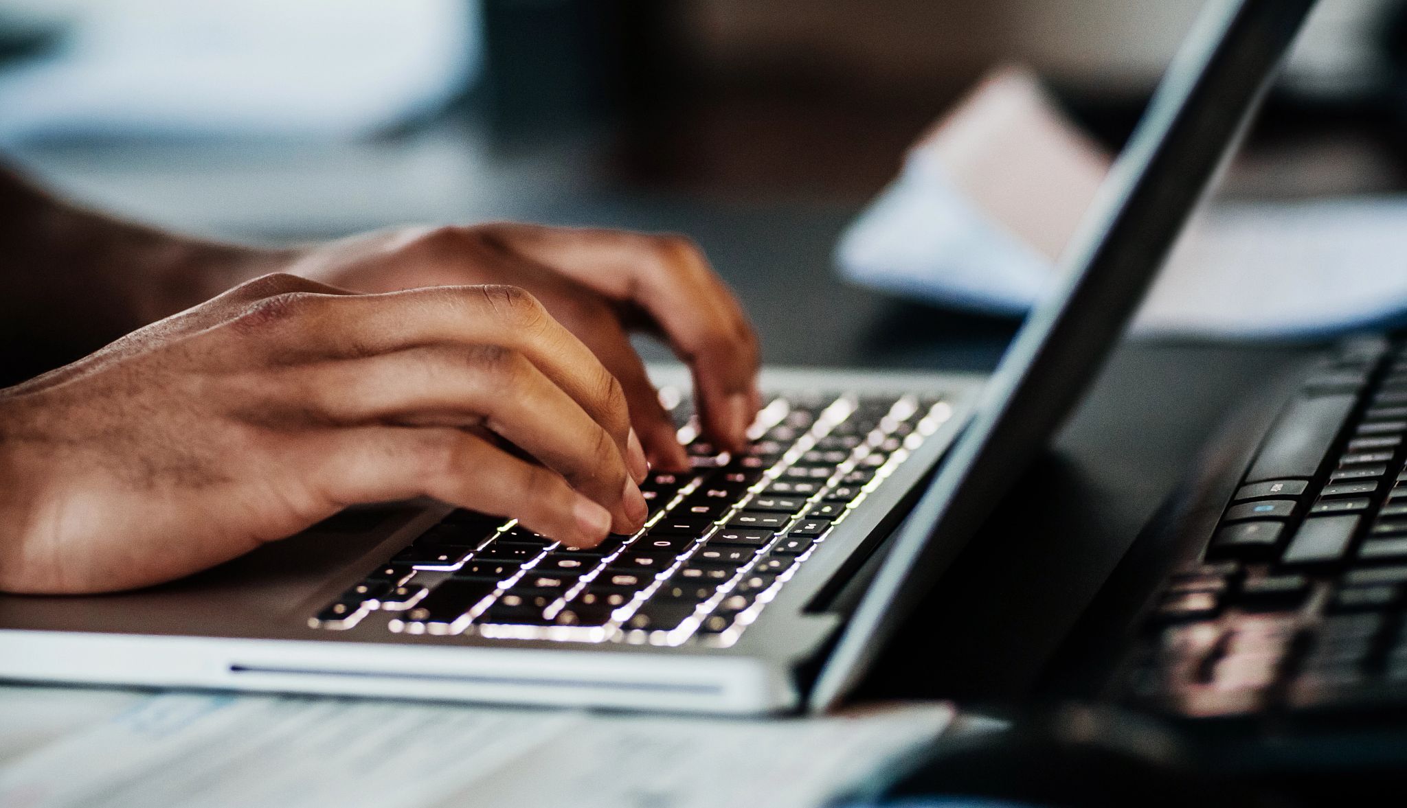 Smart Guide to Getting Hired a person typing on a laptop