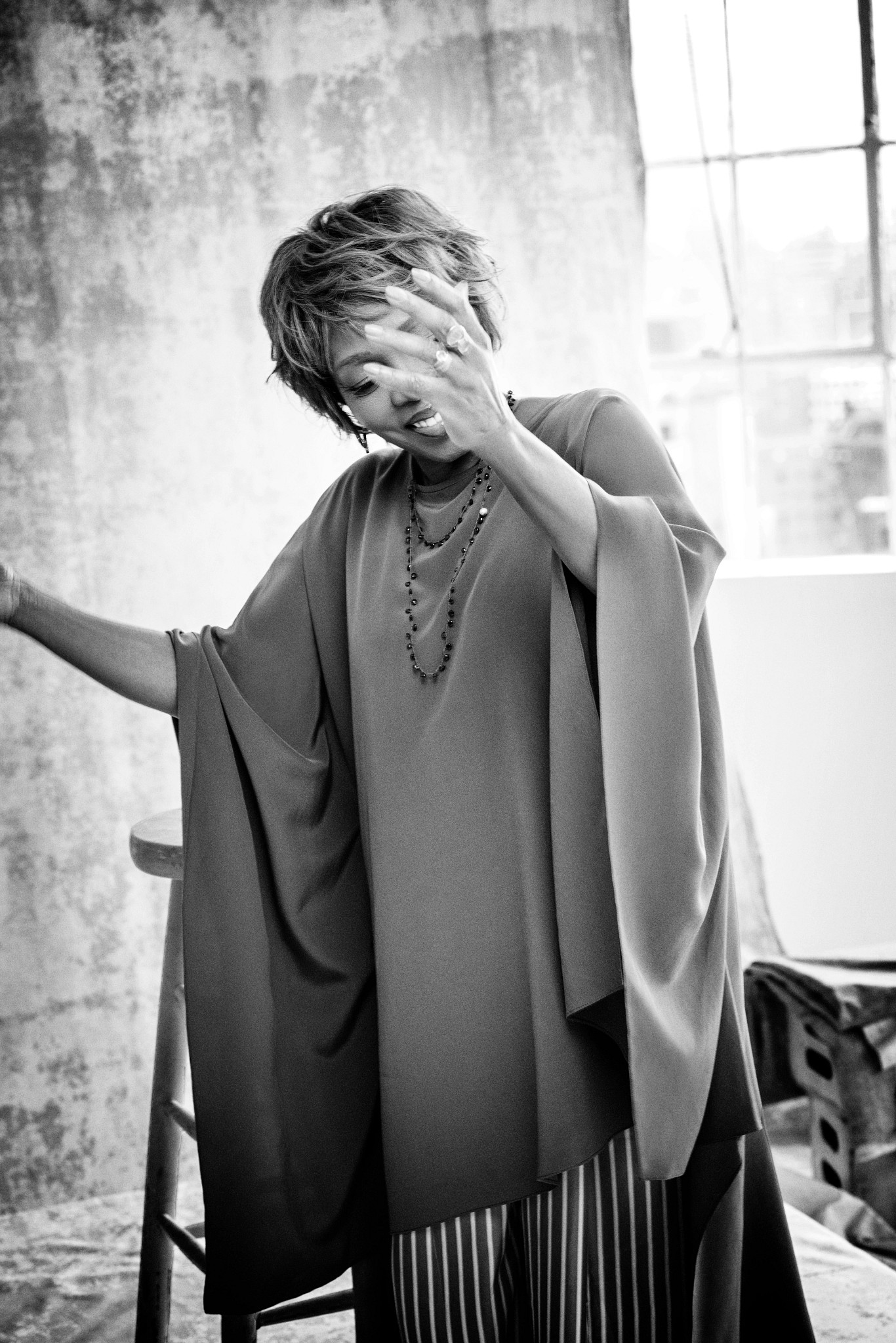 alfre woodard smiling and gesturing in a candid portrait