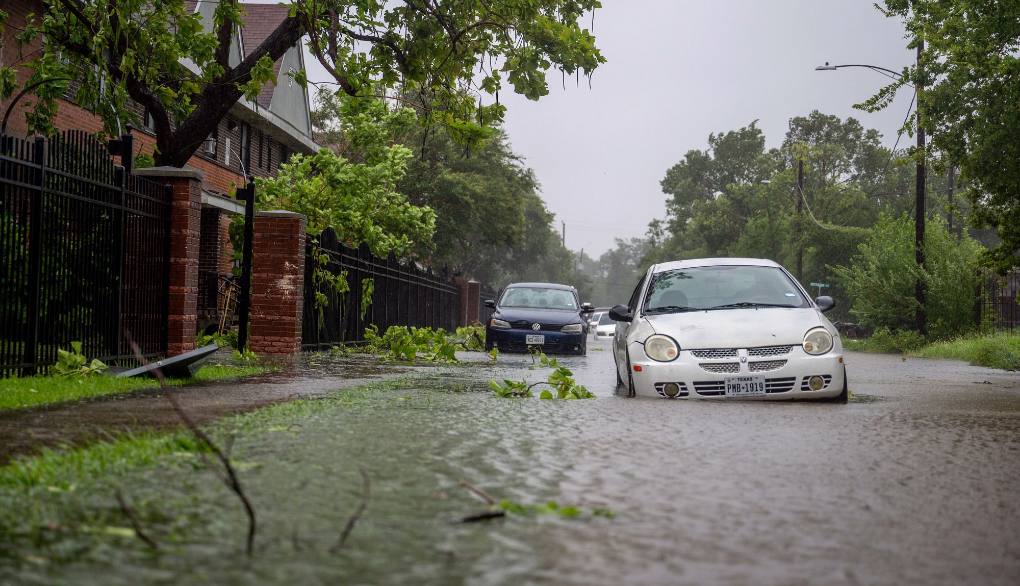 Places to Retire to Escape Extreme Weather two vehicles in flooded water