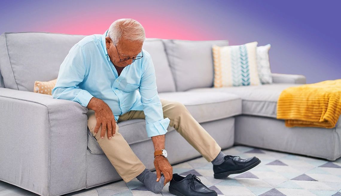 Fall Risks man on the couch rubbing his foot
