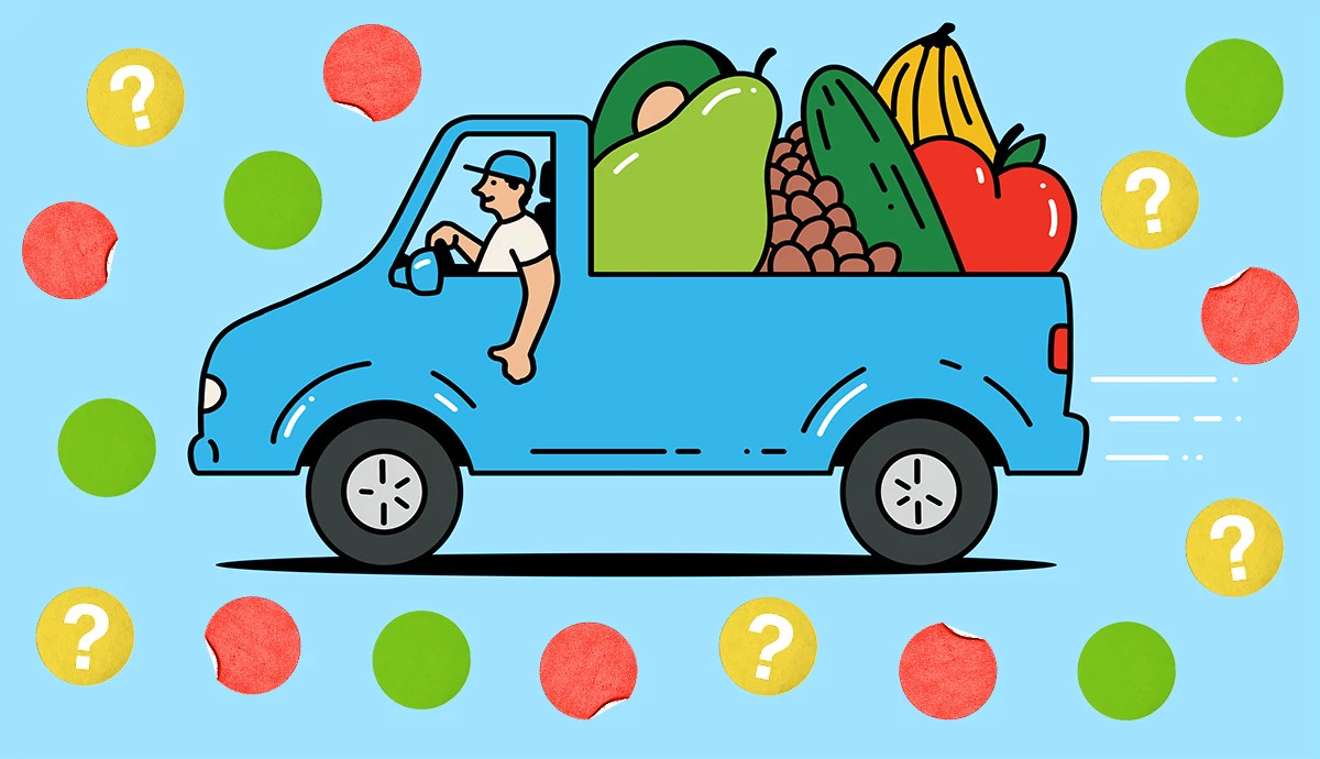 a blue truck with fruits and veggies in the back
