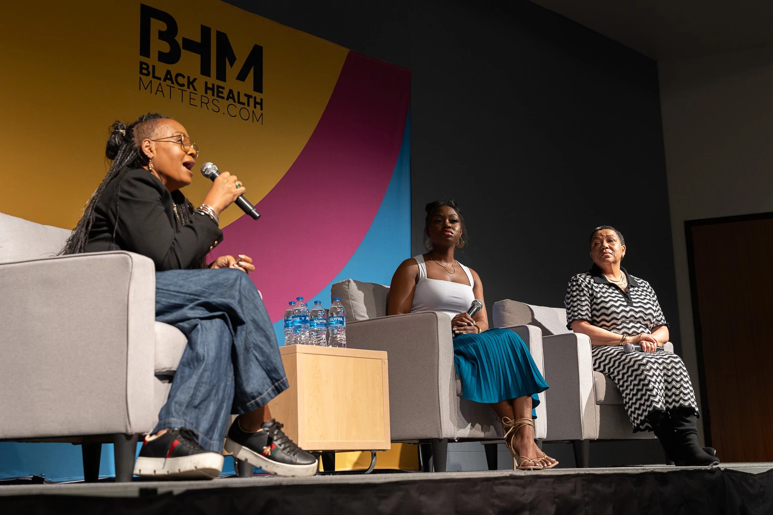 people talking on stage