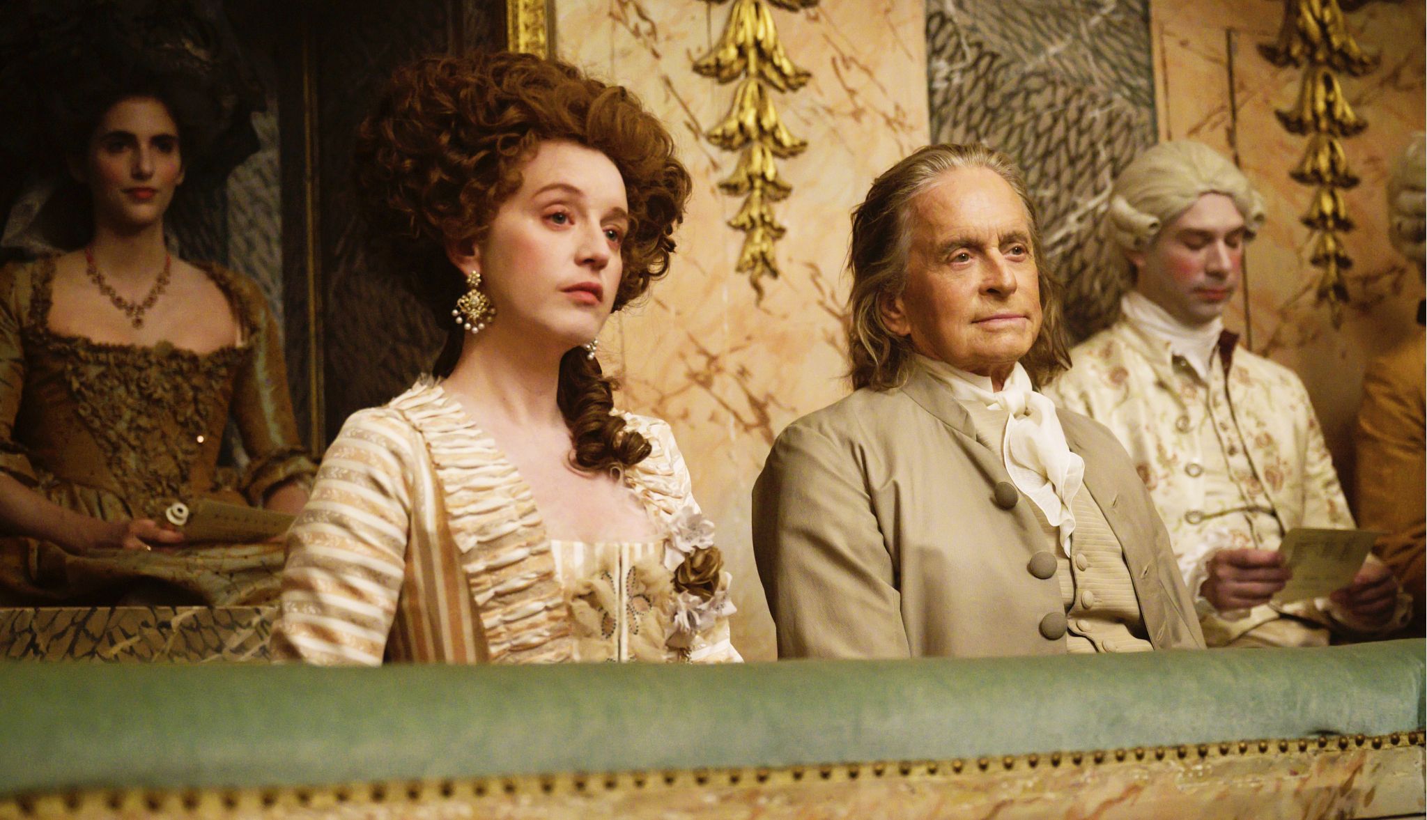 Ludivine Sagnier and Michael Douglas in the Apple TV+ series Franklin Ludivine Sagnier and Michael Douglas sitting together in a scene in the Apple TV Plus series Franklin