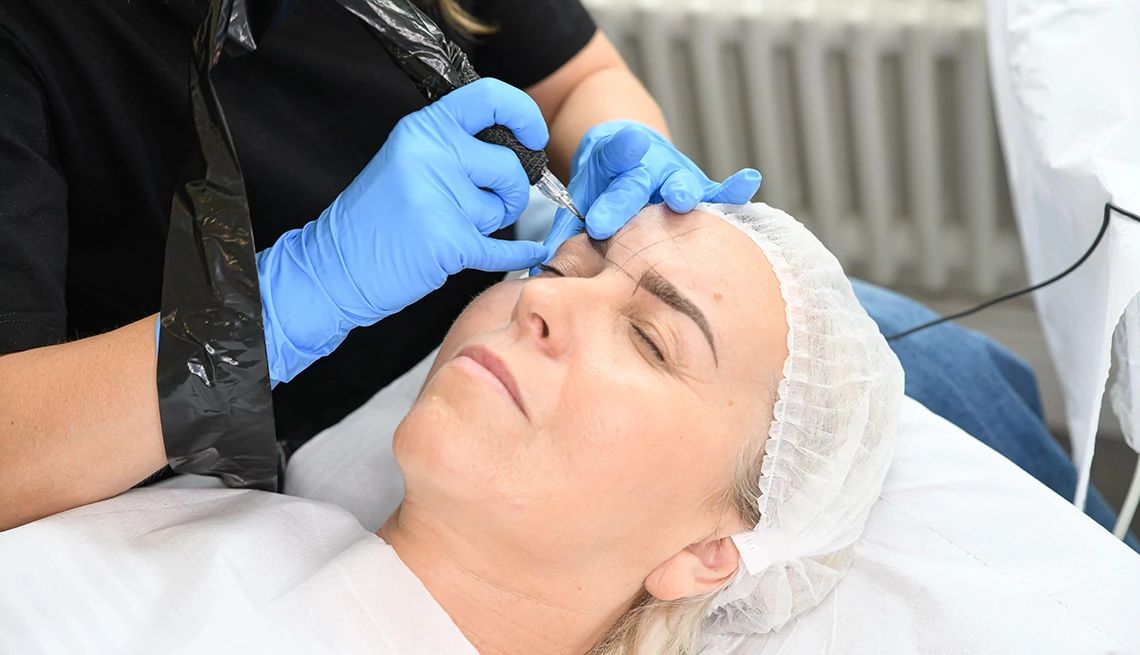 A woman undergoing a microblading procedure
