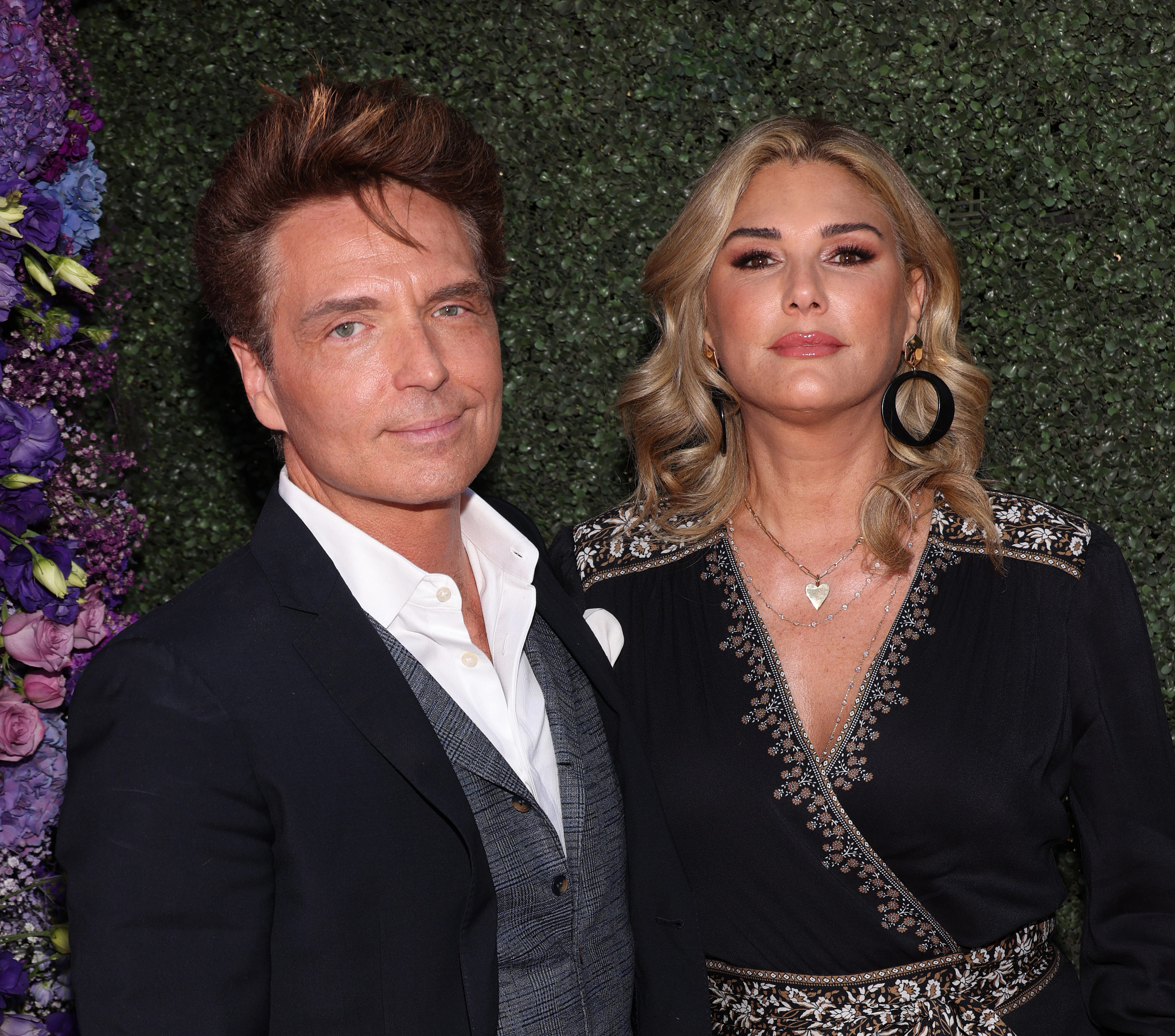 Richard Marx and Daisy Fuentes, a captivating duo, pose together