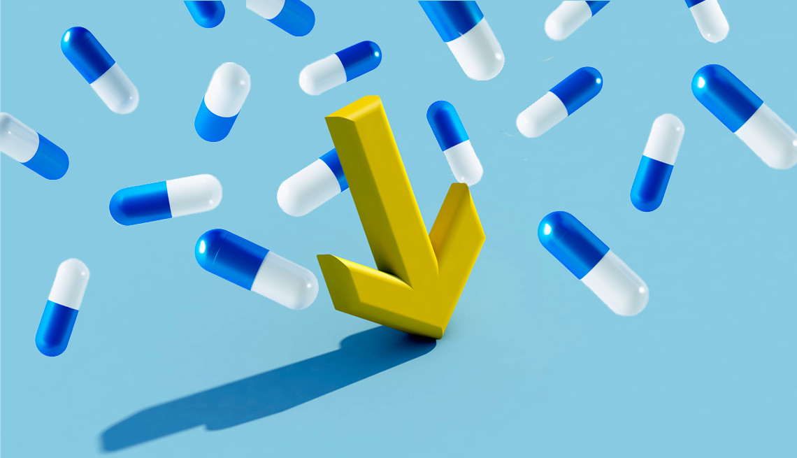 a yellow arrow pointing down with blue and whitew pills falling