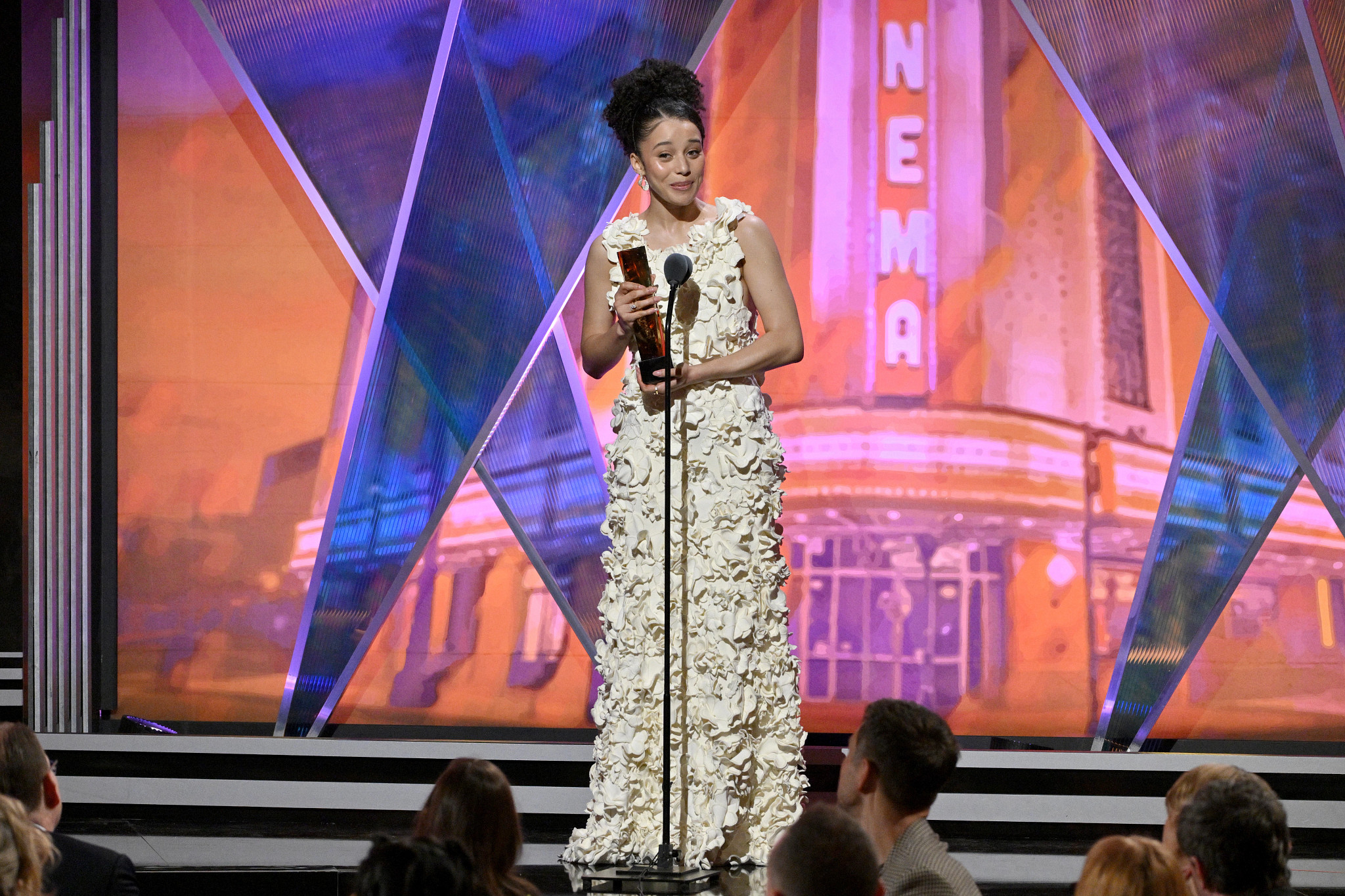 Chase Infiniti accepting an award onstage