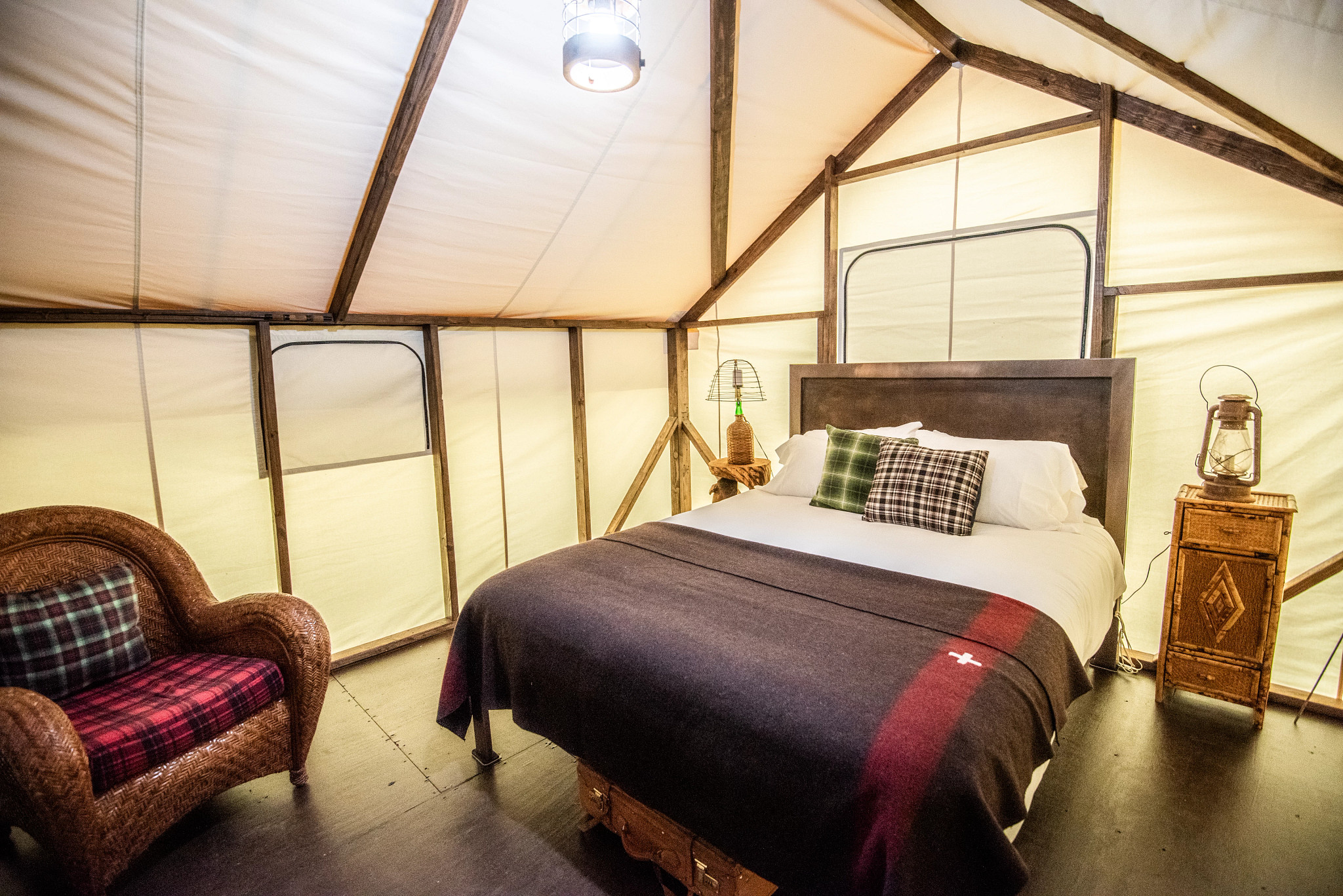 the inside of a tent with a bed