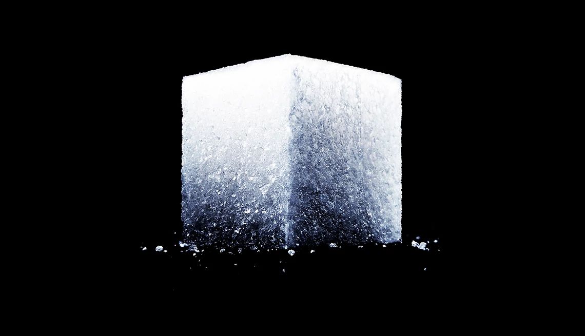 How Sugar Ages you sugar cube on black background