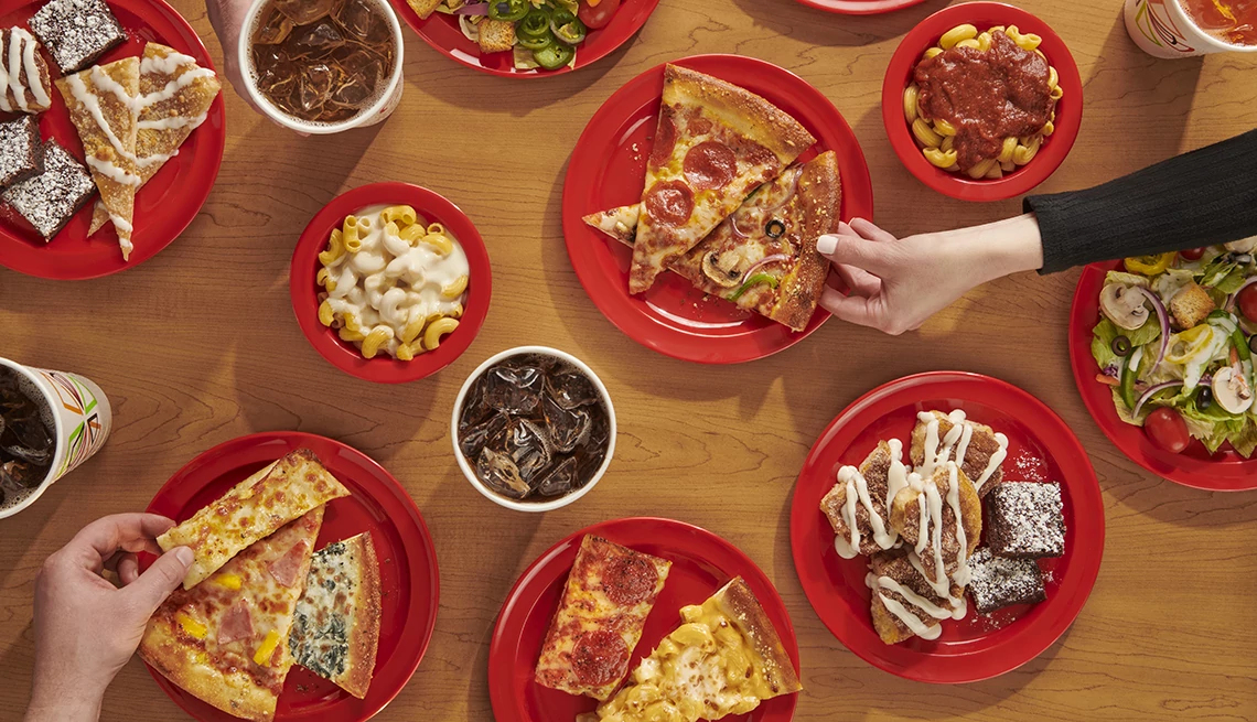 Menu items from Cici's Pizza displayed on table from an overhead view