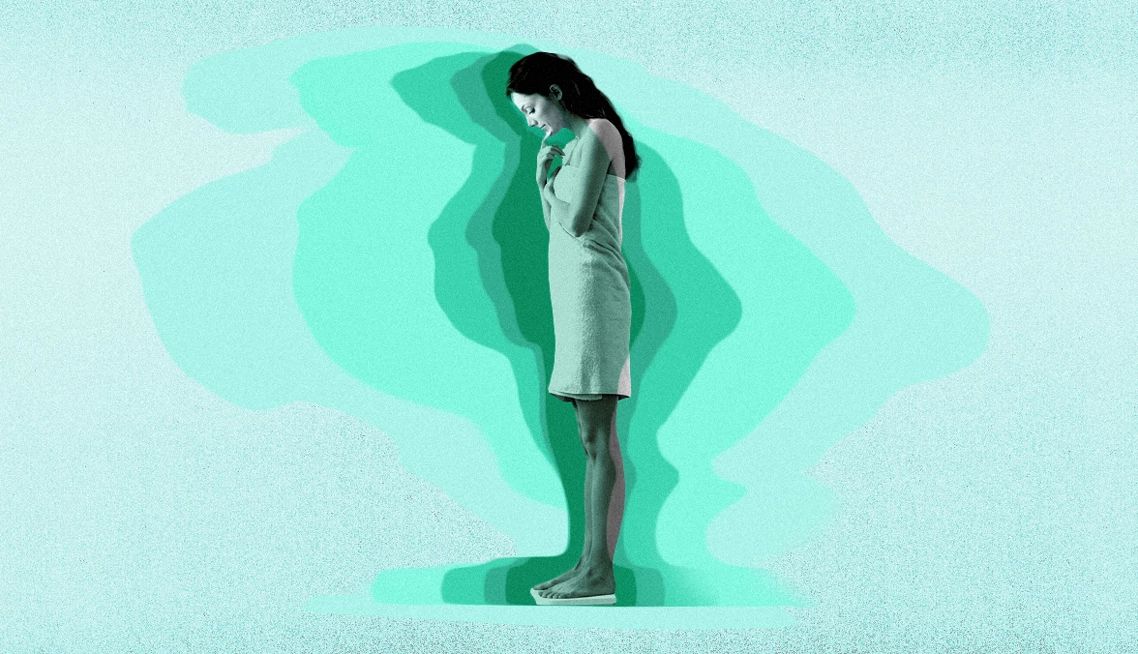 Eating Disorders a person looking down at a scale