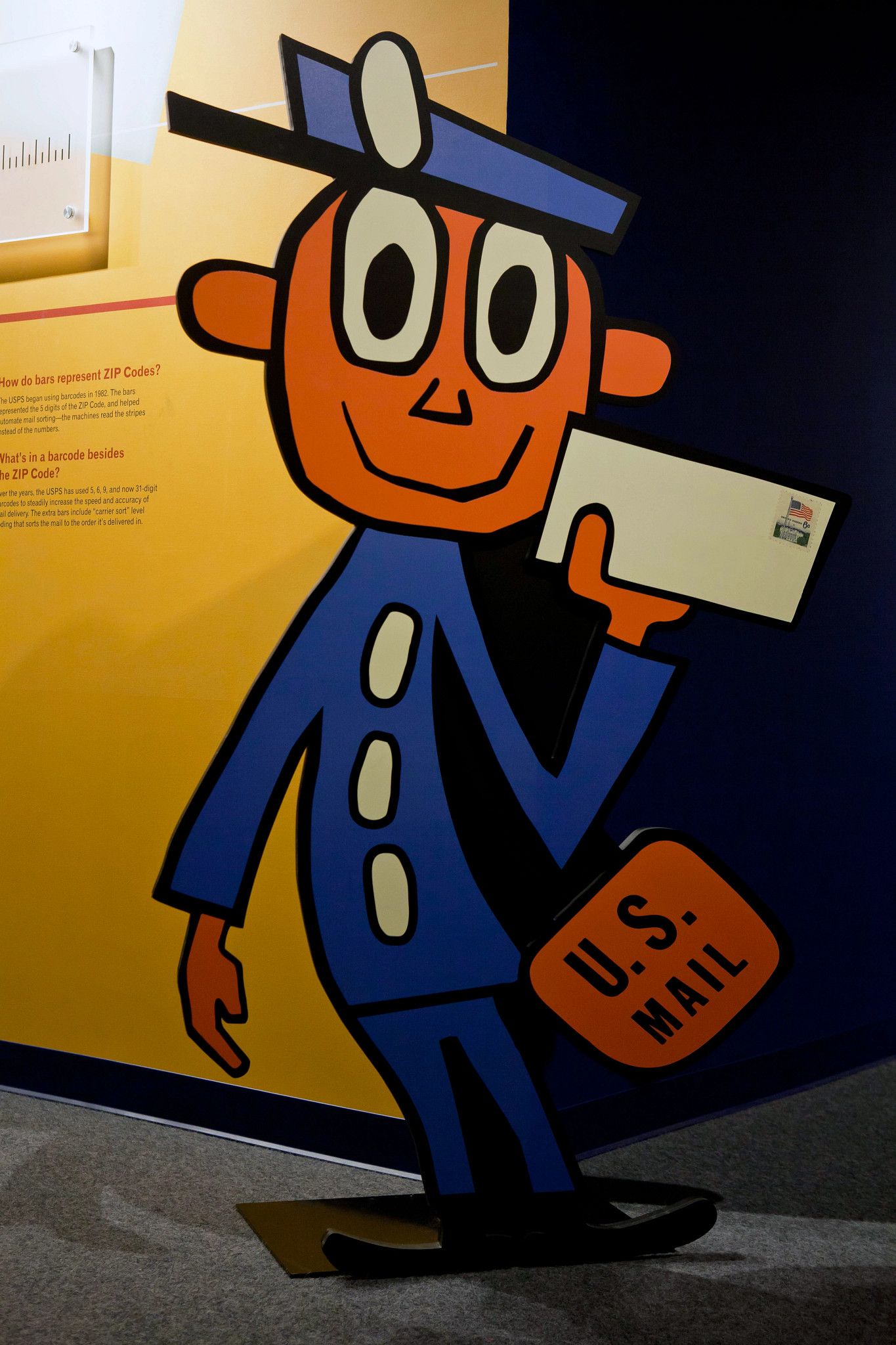 a cardboard cutout of Mr. Zip is shown in a photo
