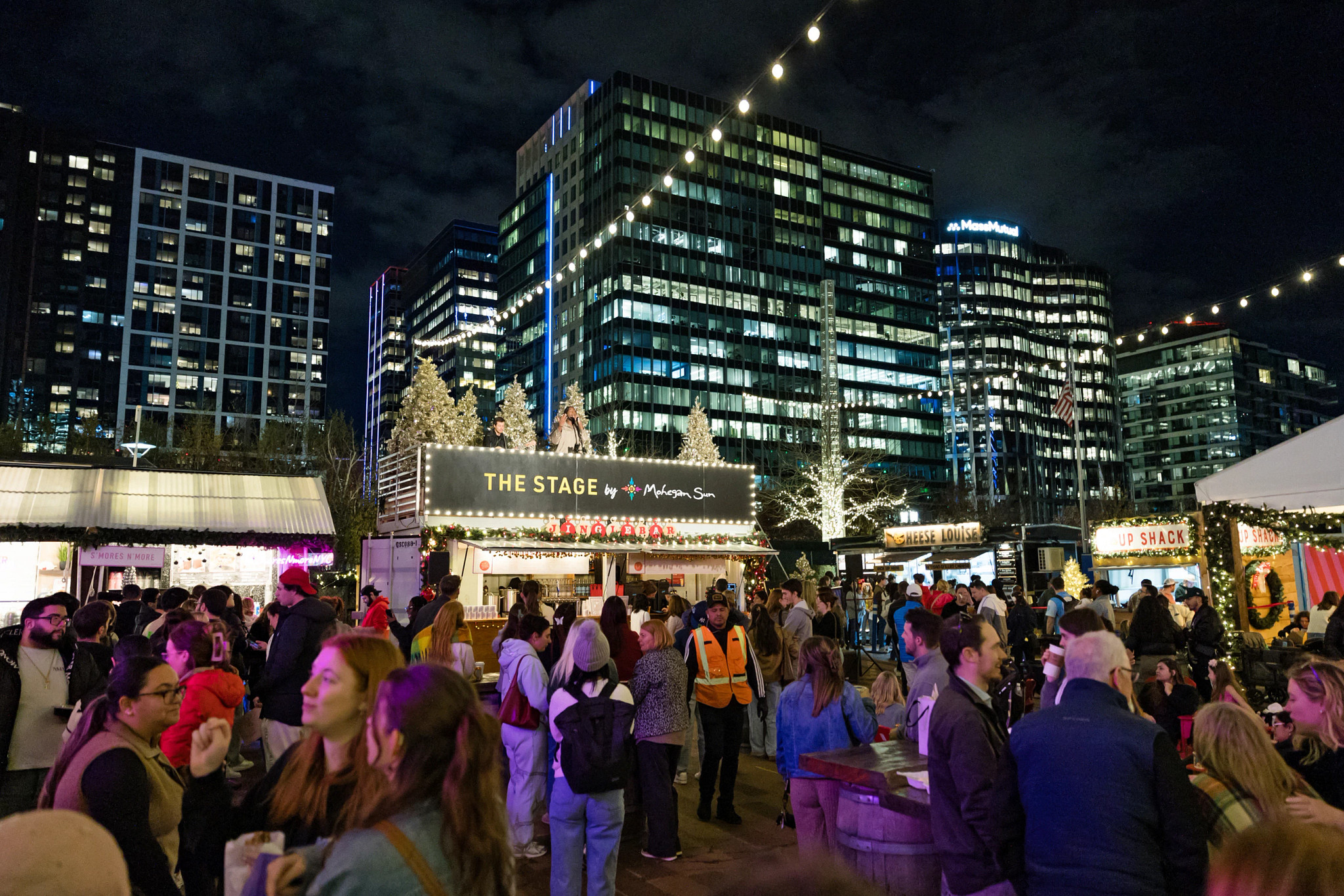 a holiday market filled with shoppers