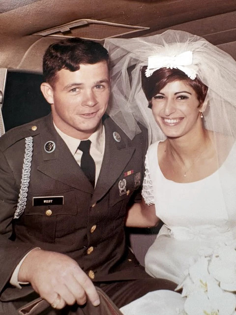 linda port and john hayden west posing together on their wedding day