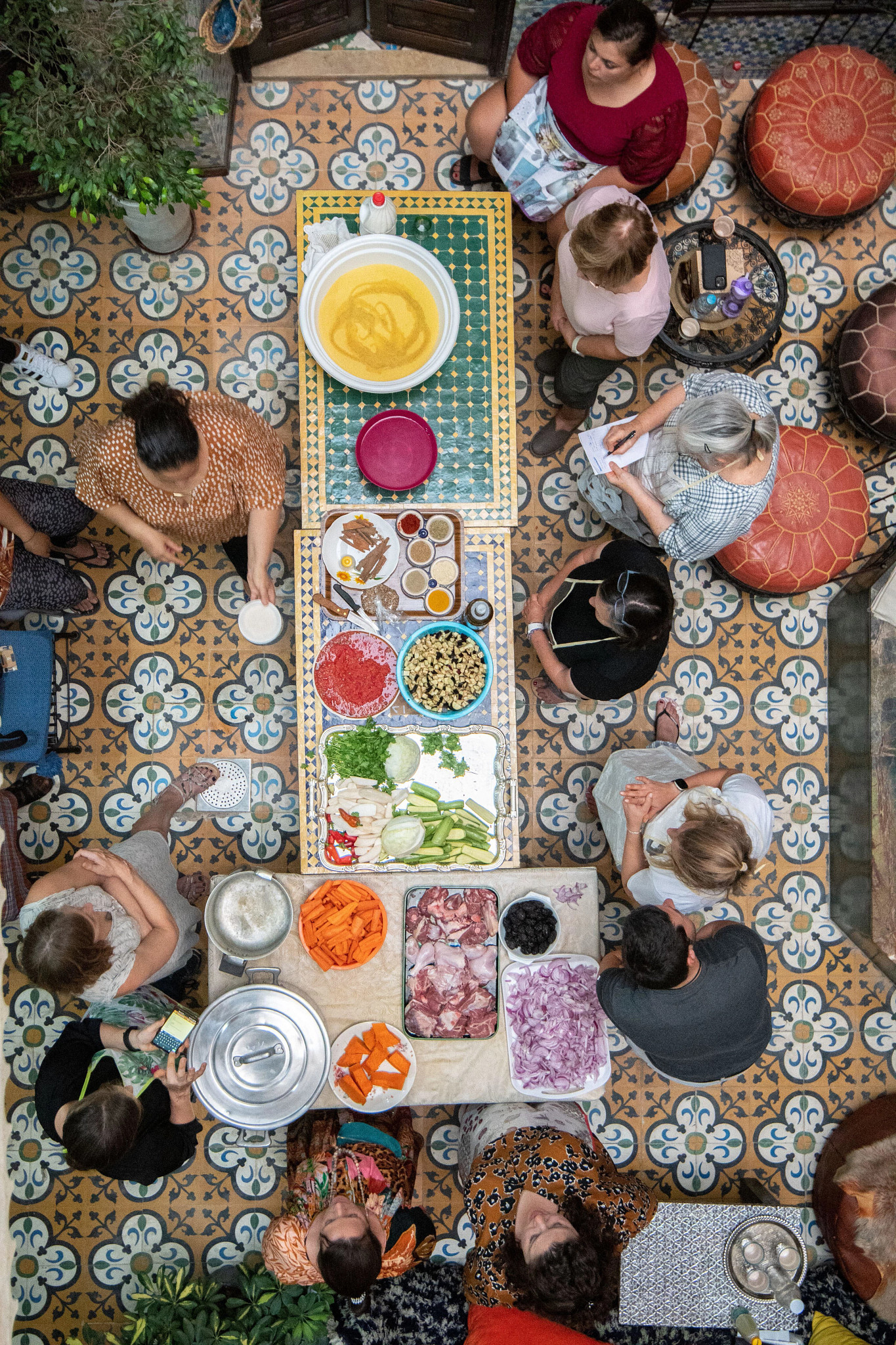 an overview of people standing near food on a table in Morocco