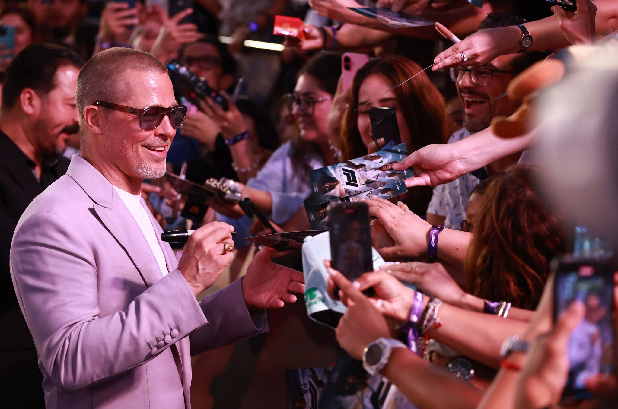 Brad Pitt Says He Feels ‘Reinvigorated’ by His Career Brad Pitt signing autgraphs for fans