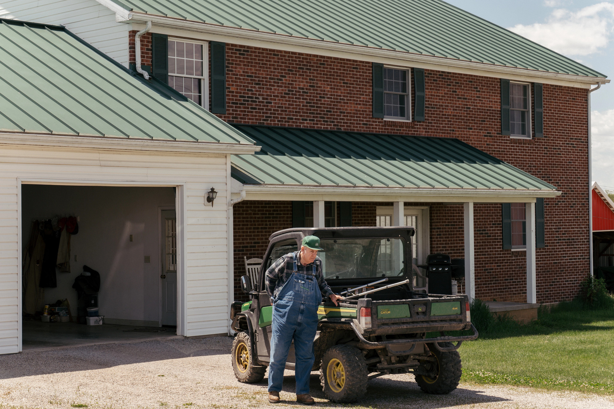 a farmer outside of his home