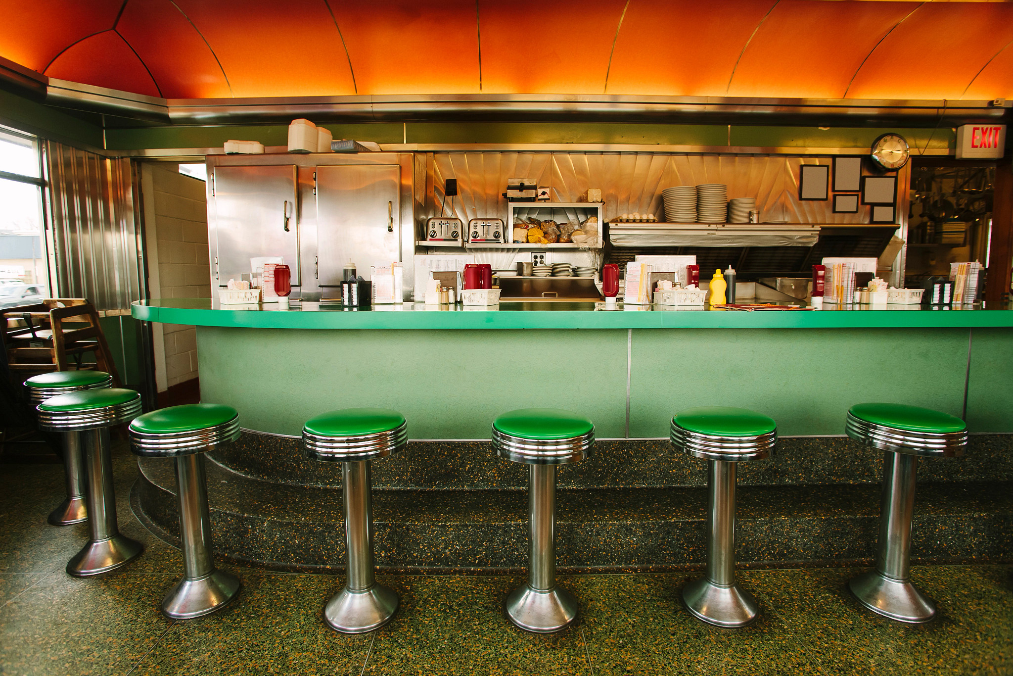 a diner with empty chairs