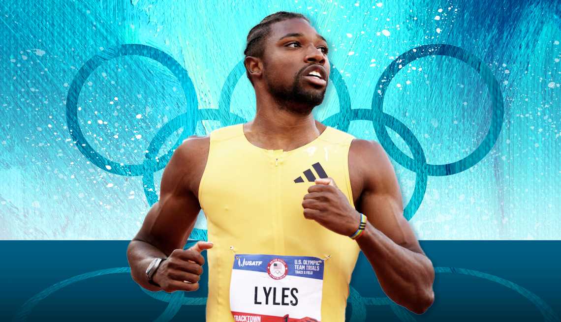 Noah Lyles Competing at the Olympics professional track and field Noah Lyles with Olympic rings on a blue background