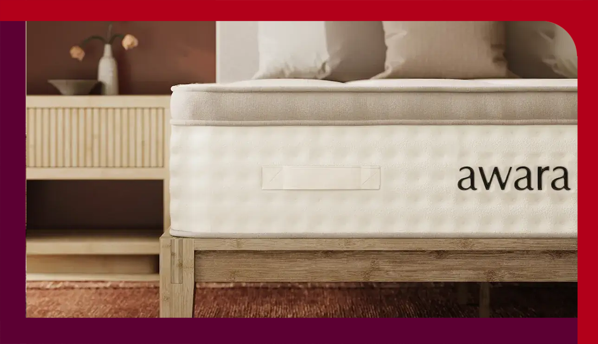 The Awara Premier Hybrid mattress on a wooden bed frame in a bedroom 