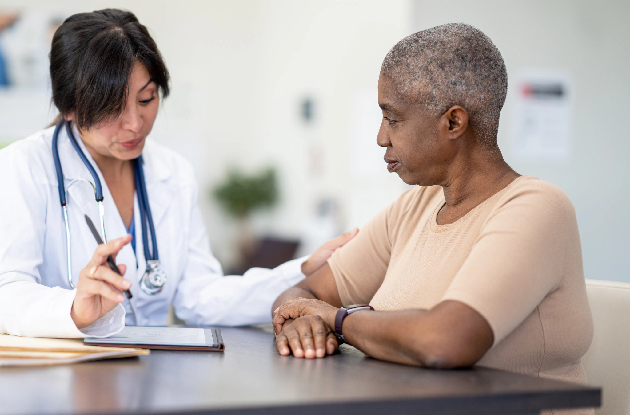 a person talking to their doctor