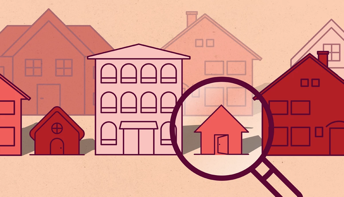 An illustration of houses and apartment buildings of varying sizes and colors with a magnifying glass highlighting one of the houses