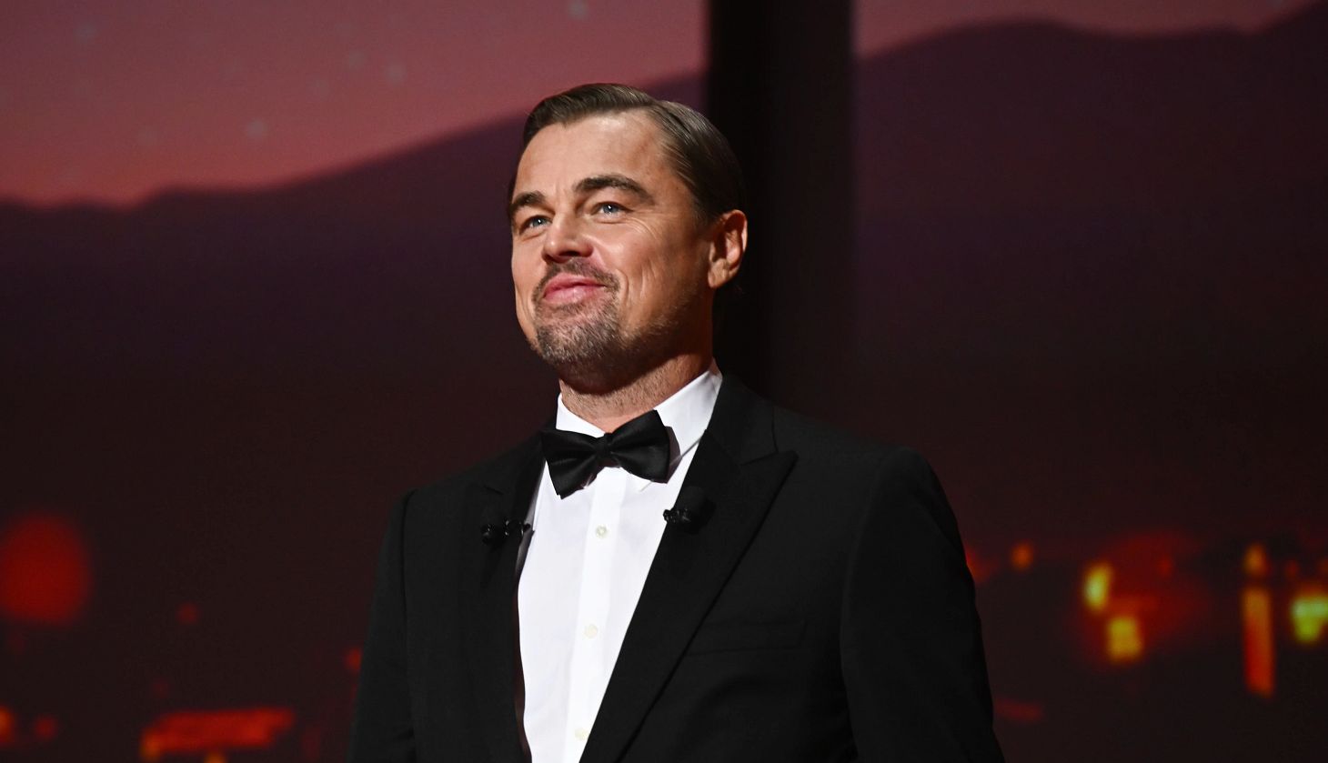 Leonardo DiCaprio Wants to Be More Authentic leonardo dicaprio smiling while wearing a tuxedo