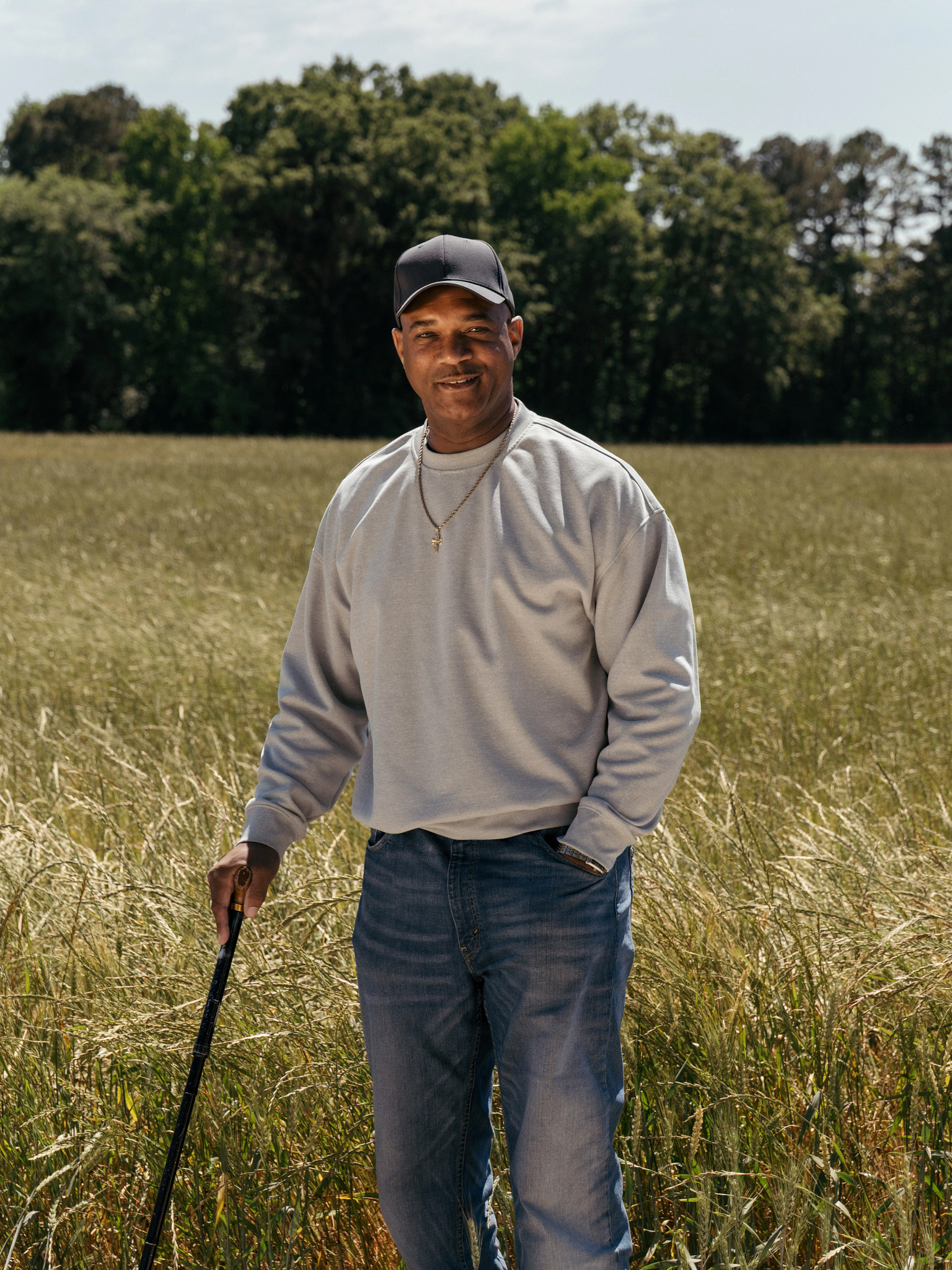 a farmer standing in a field