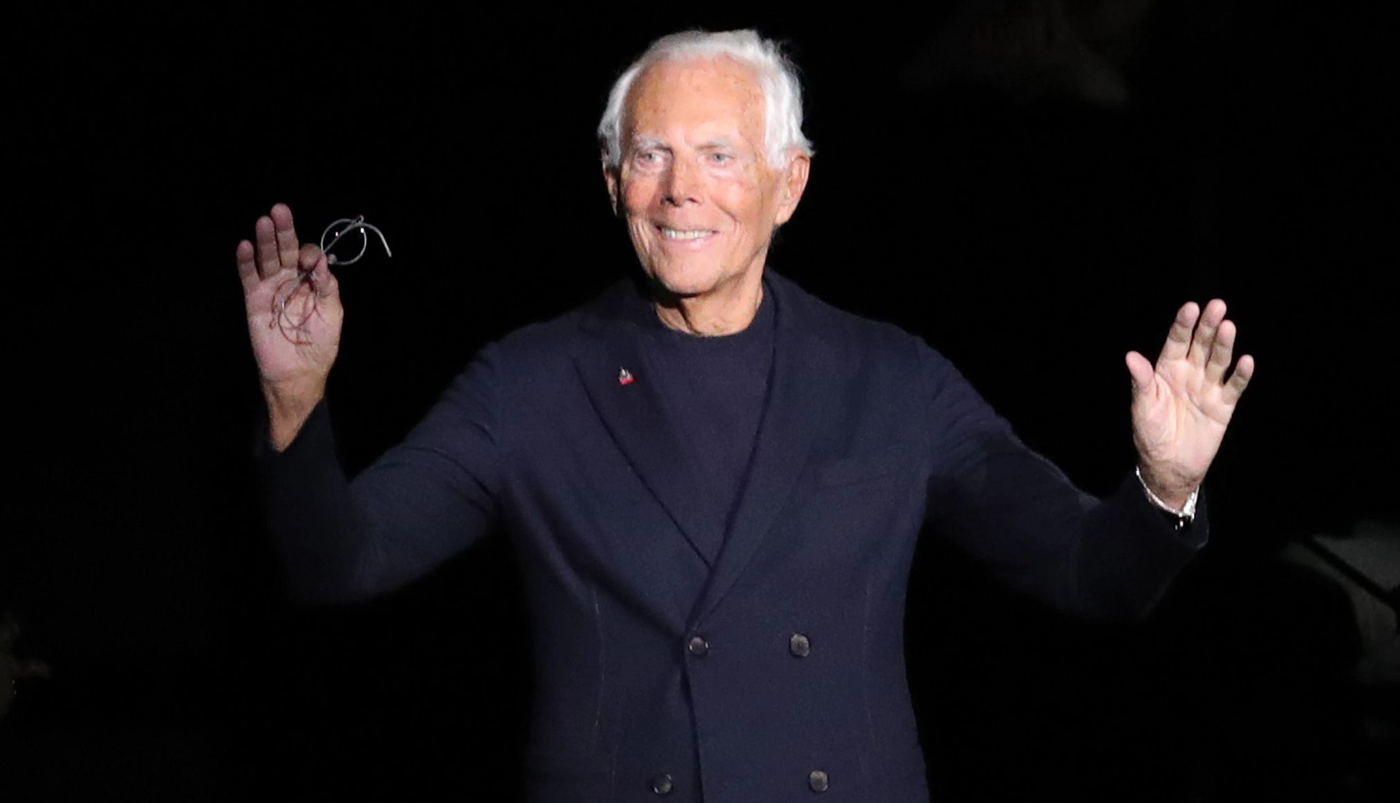Fashion Icon Giorgio Armani Dies at 91 giorgio armani waves to the crowd