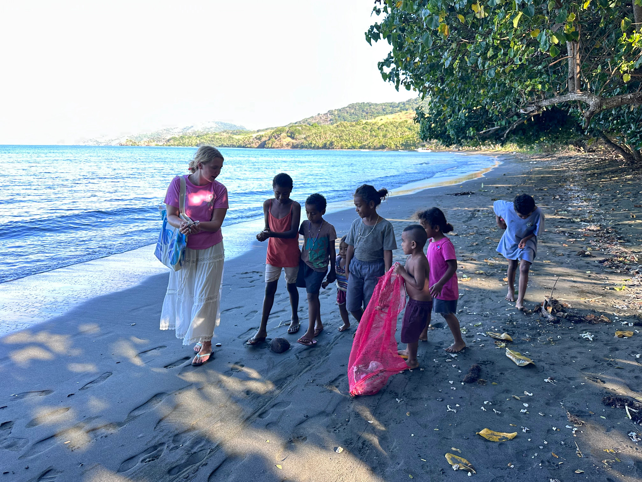 two people doing a beach cleanup