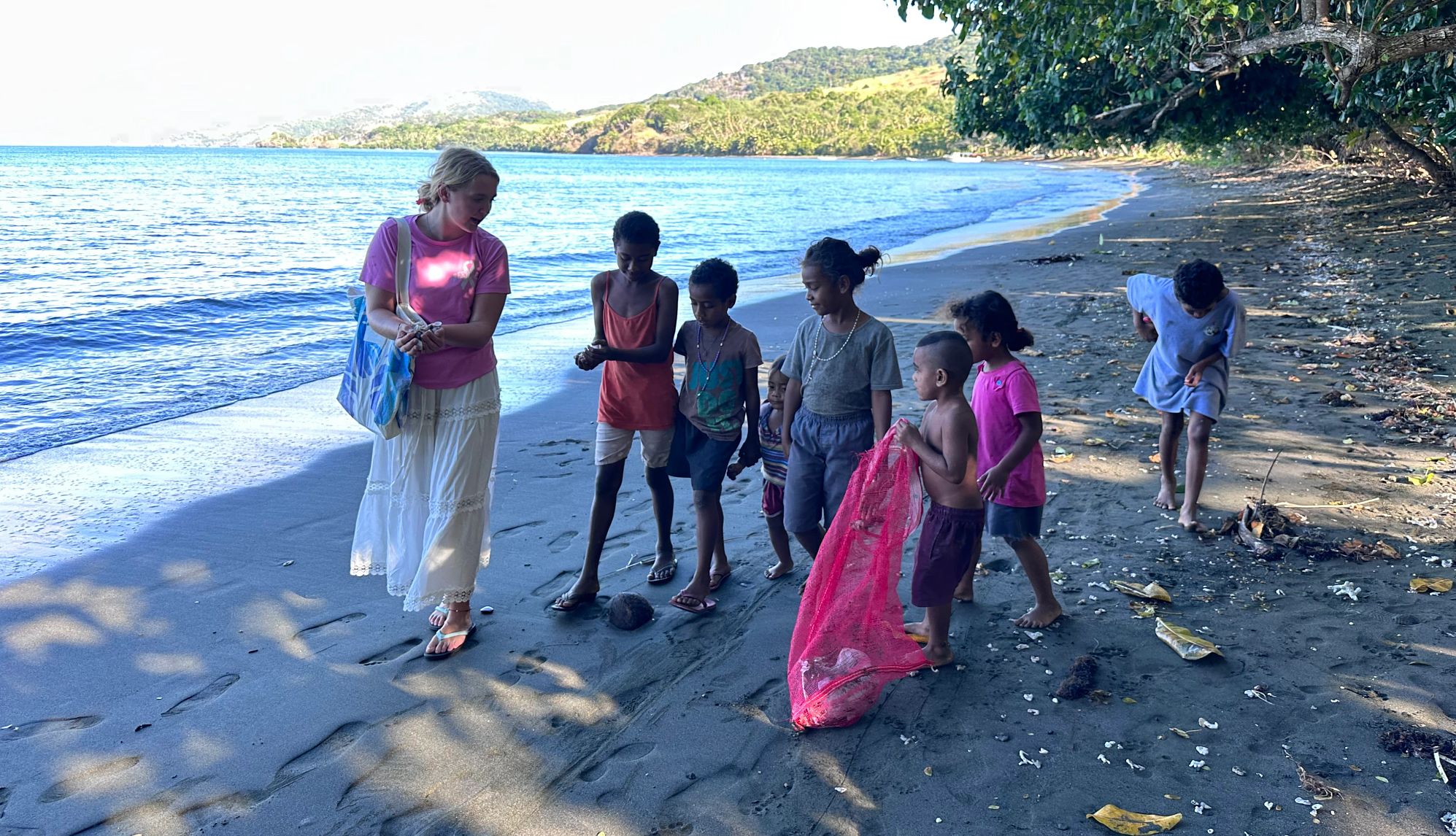 Beach cleanup two people doing a beach cleanup