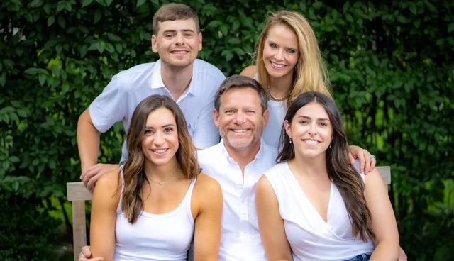 A happy family portrait Dave and Karen Hurwitt pose with their family portrait