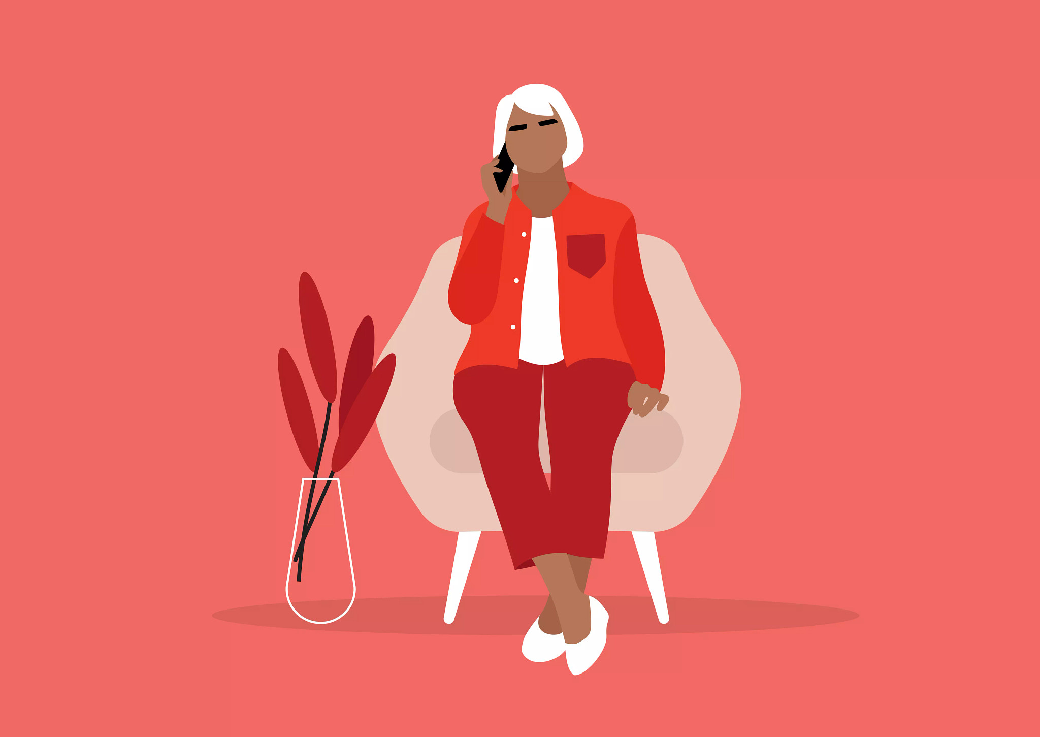 a person sitting on a chair on a phone