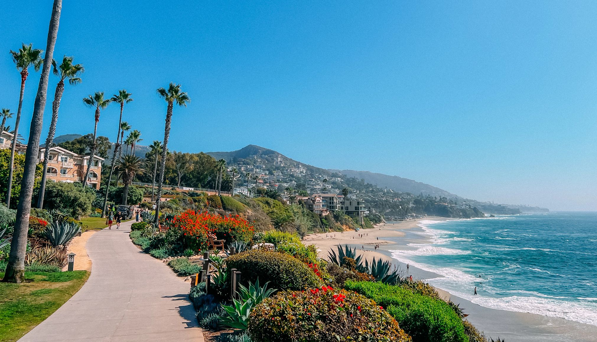 Charming California Seaside Towns a walkway above a beach